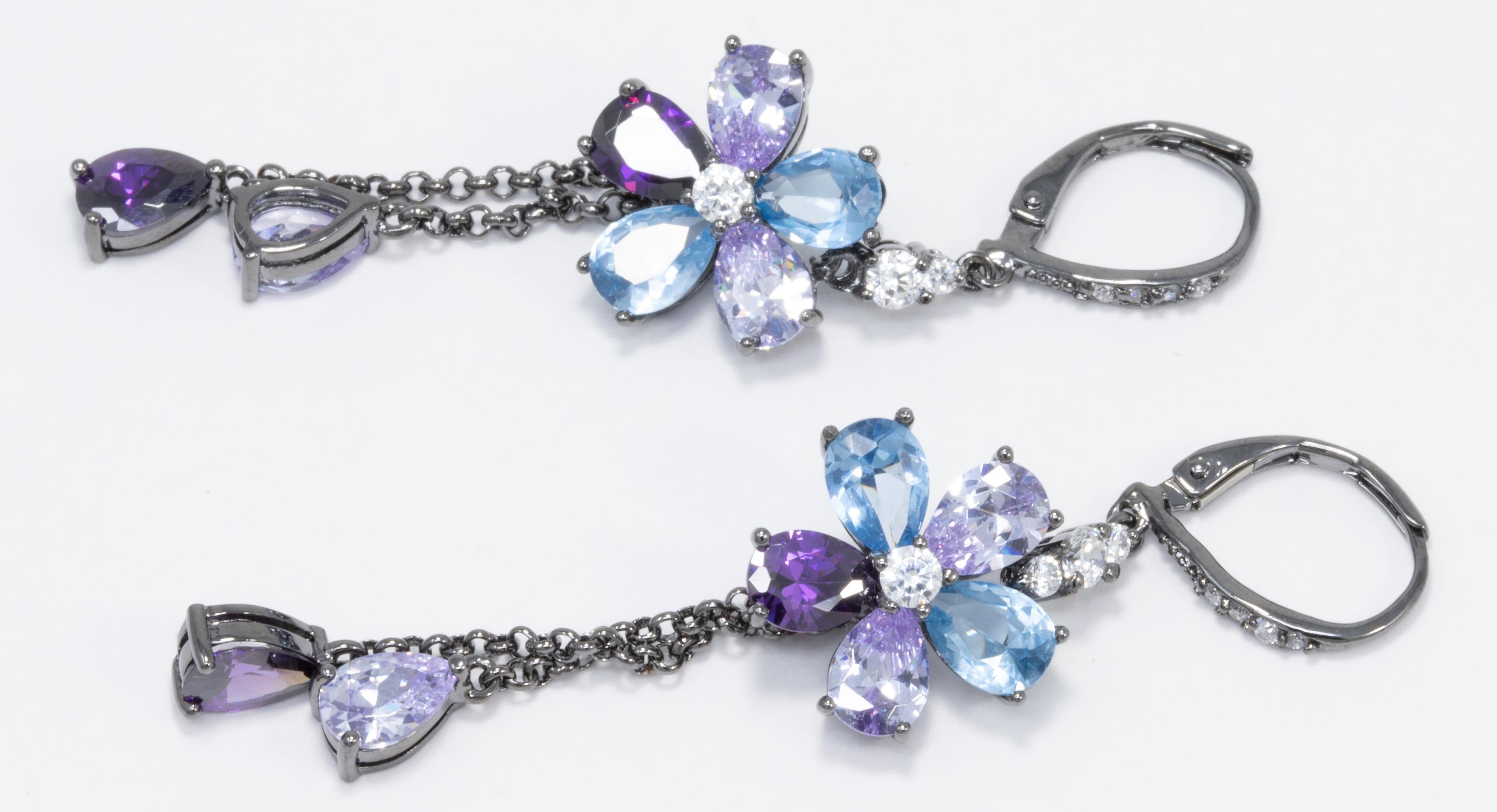 Add some floral sparkle to your outfit with these dangle flower earrings by Kenneth Jay Lane!

Clear, rose, aquamarine, and amethyst cubic zirconia crystals. Lever hook closure.

Marks/Hallmarks: KJL

CZ by Kenneth Jay Lane line. Designed in New