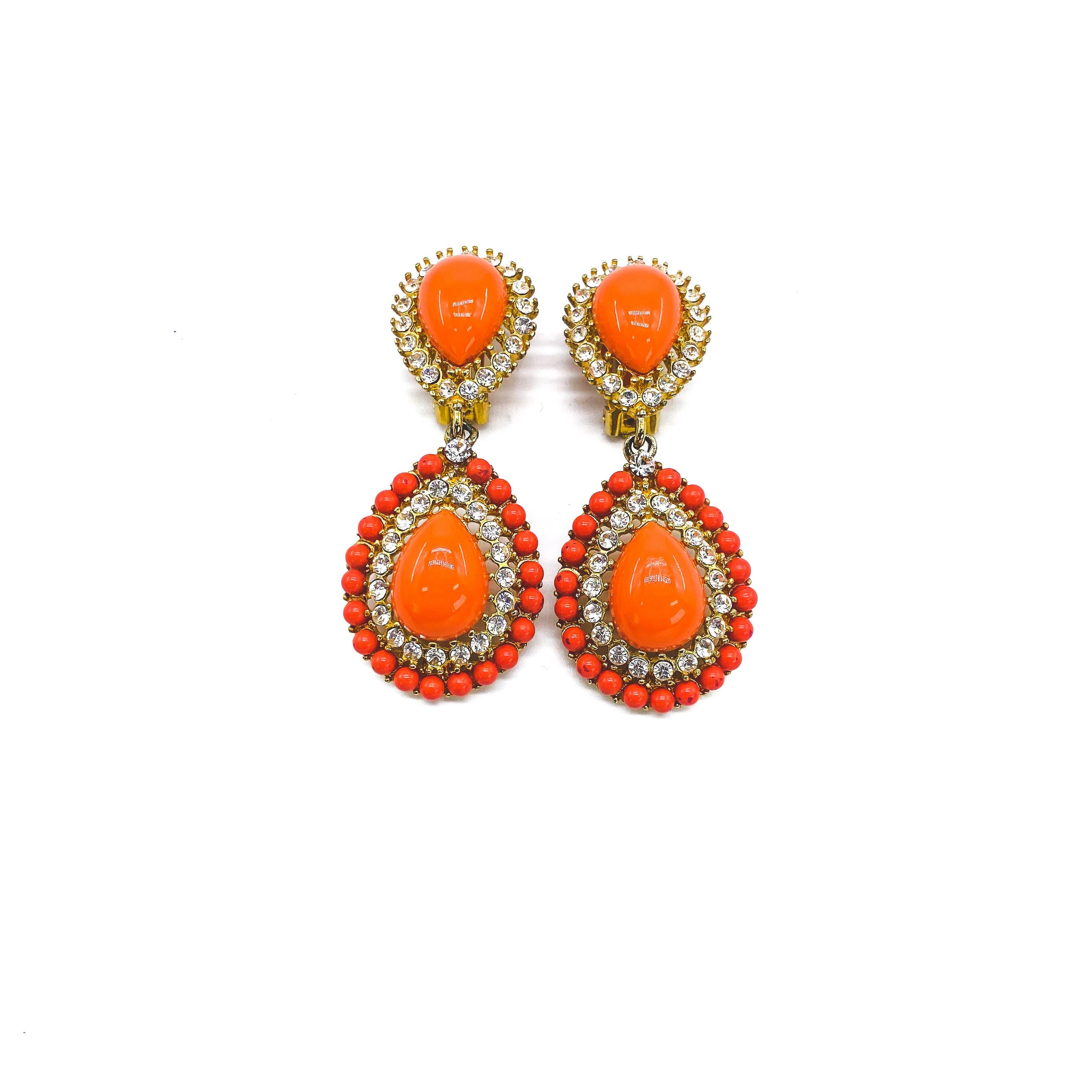Kenneth Jay Lane Vintage 1990s Clip On Earrings

Beautiful crystal encrusted drop earrings from Kenneth Jay Lane - America's most famous costume jeweller.

Detail
-Crafted in a rich coral coloured lucite  
-Formed of two teardrops set with sparkling