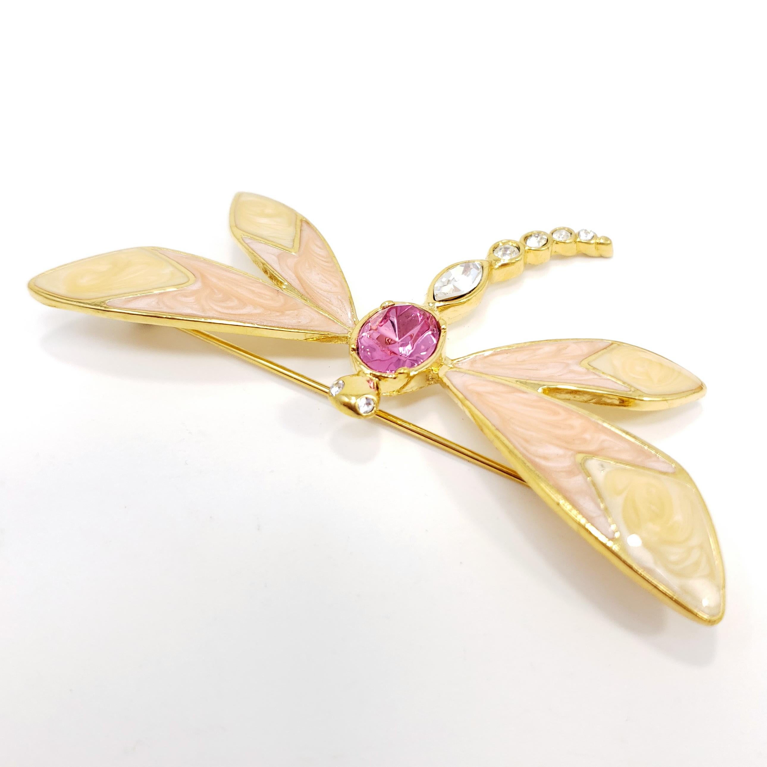 Golden butterfly brooch with marbled, coral-colored inlays and sparkling Swarovski crystals. By Kenneth Jay Lane for Avon.

Gold-plated. Circa 1980s.

Marks / hallmarks: KJL for Avon