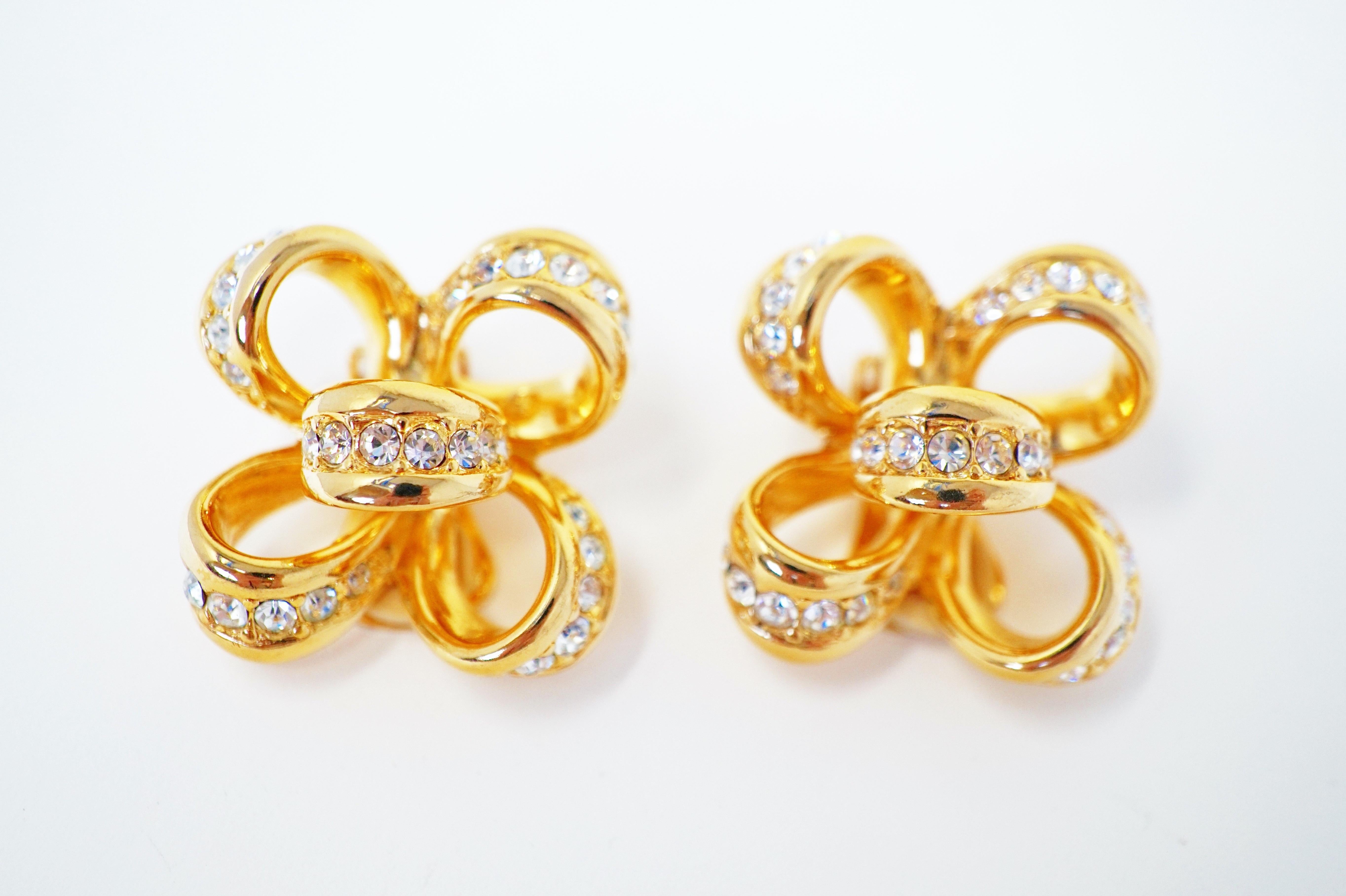 These dazzling & shiny gold-plated clip-on bow earrings by Kenneth Jay Lane are studded with faceted Swarovski crystals and are the perfect compliment to your holiday look!

With a career spanning over 5 decades, the legendary New York designer