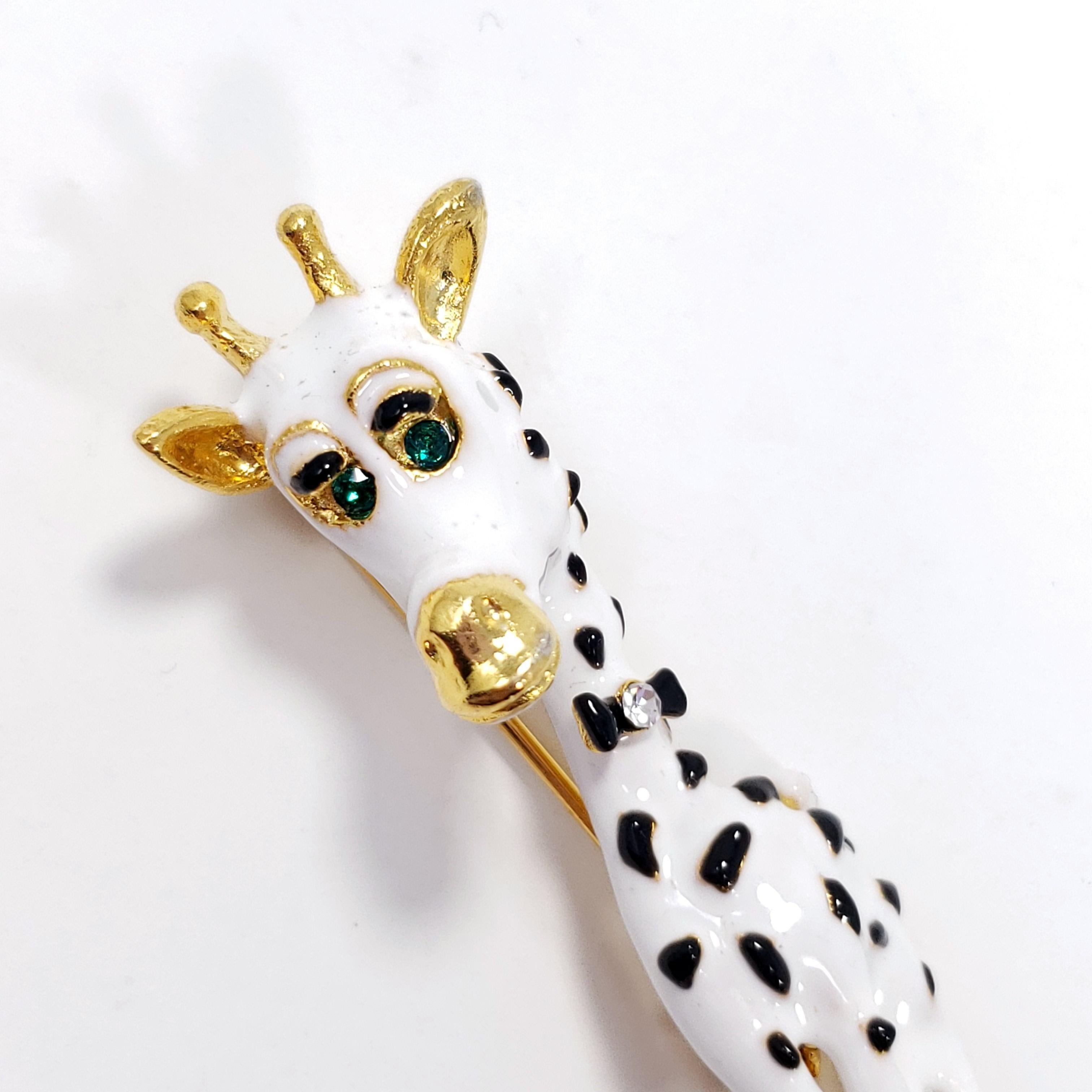 Whimsical giraffe pin Kenneth Jay Lane. This stylish black and white giraffe is wearing a crystal-accented bow tie, dressed for any classy occasion!

Vintage 90s collector's costume jewelry pin, wonderfully preserved and never worn.

Hallmarks,