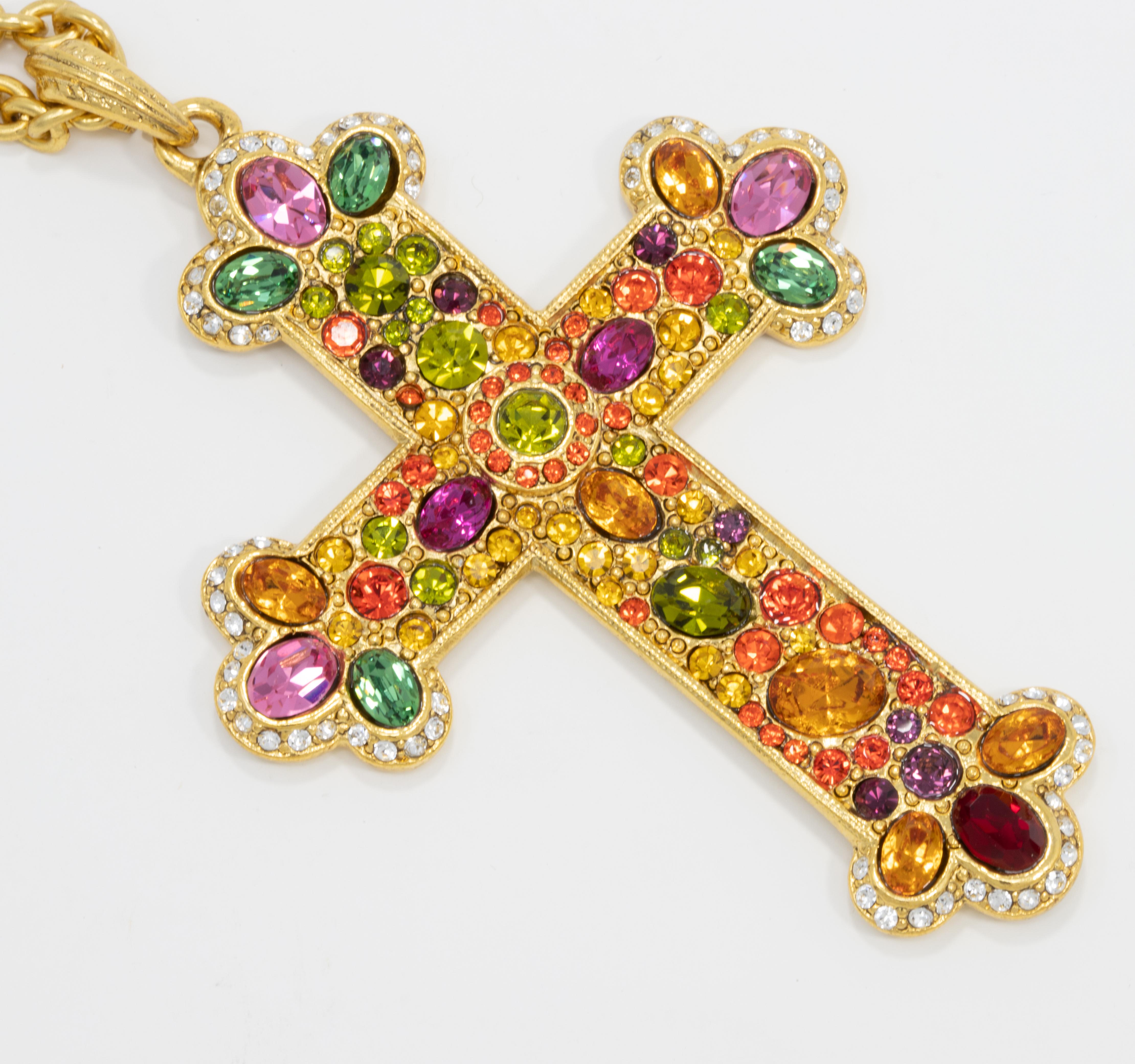 Stunning golden pendant rope necklace from Kenneth Jay Lane! The large statement cross is decorated with colorful crystals

Necklace is 27.5 inches around.

Marks: KJL