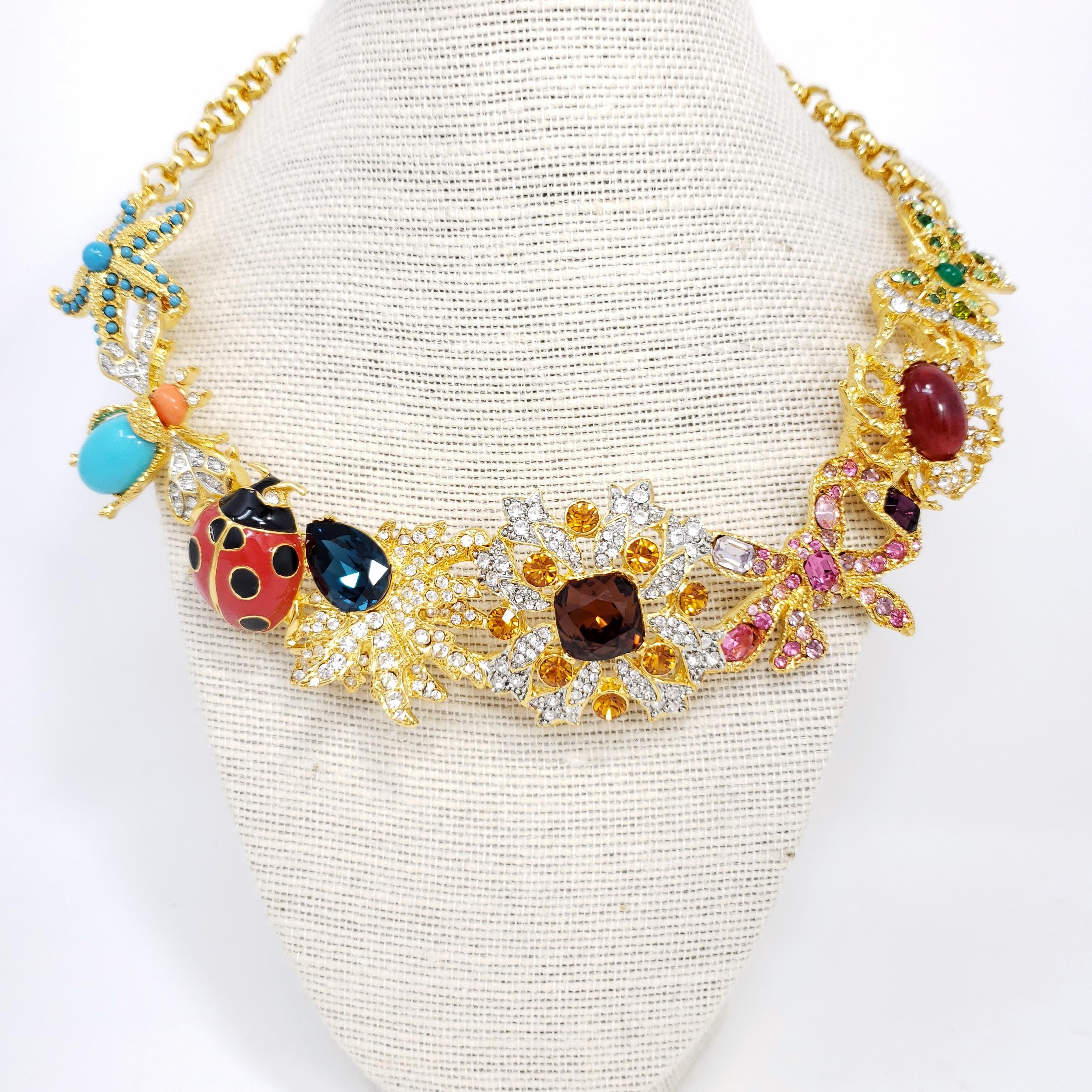 Kaleidoscope necklace by Kenneth Jay Lane. Signature KJL designs linked together to form a dazzling statement necklace! Colorful starfish, fly, ladybug, butterfly, jelly belly spider, flower, and leaf motifs.

Features faux pearls, painted enamel,