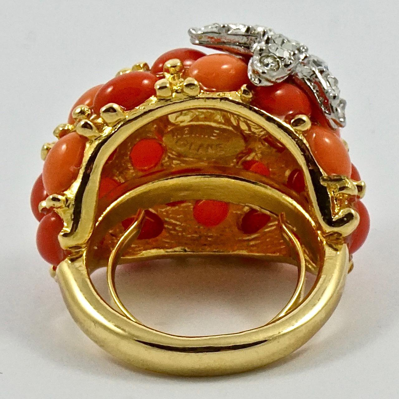 Beautiful Kenneth Jay Lane gold plated bombé cocktail ring, set with pale and dark faux coral stones, and embellished with a lovely crystal starfish. Ring size UK N, US 6 1/2, but will adjust to fit a smaller size with the integral sizer. The ring