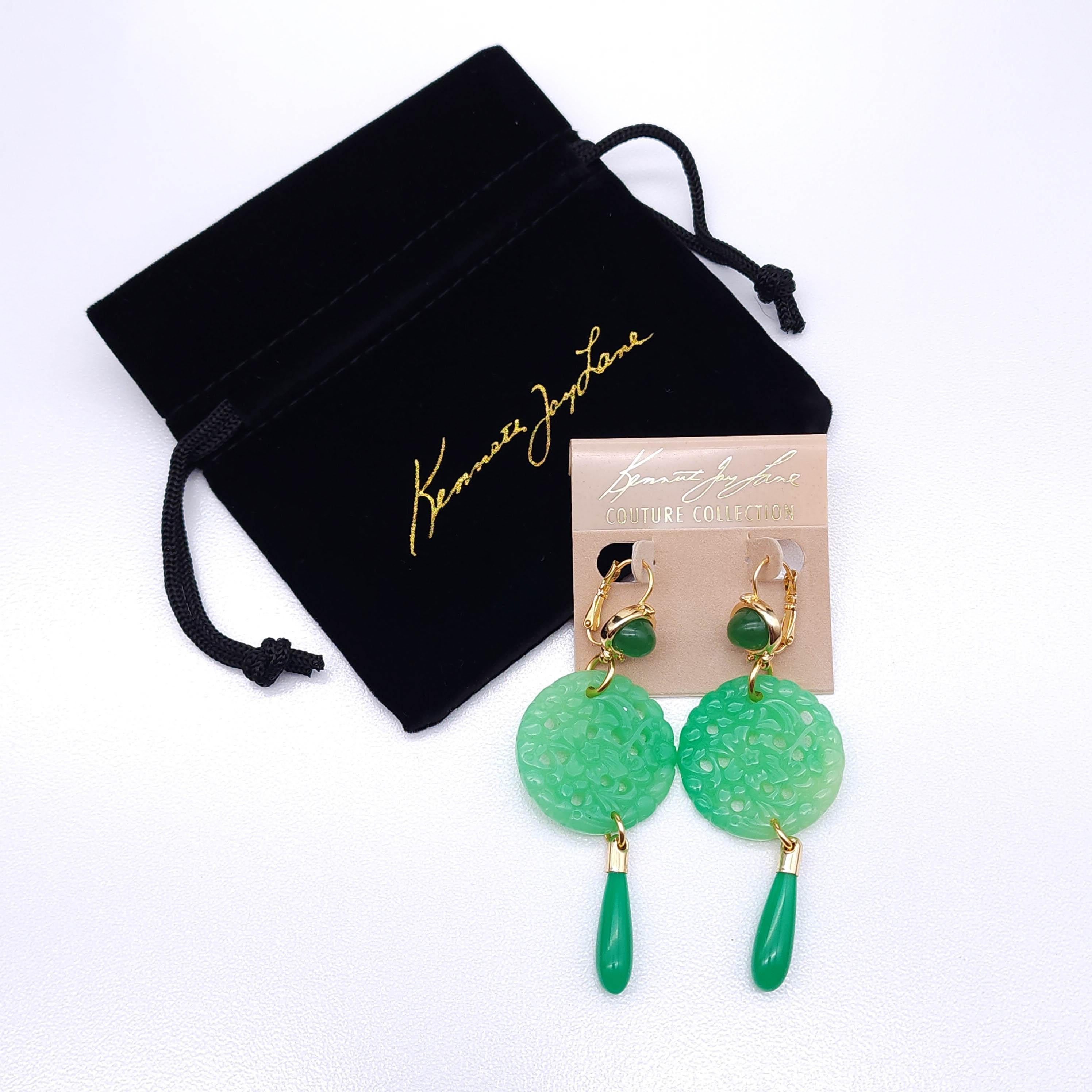 Enhance your style with these Kenneth Jay Lane earrings from the Couture Collection! Featuring sophisticated faux jade round pendants with intricate carved patterns and vibrant jade teardrop accents, these earrings make a striking statement. The