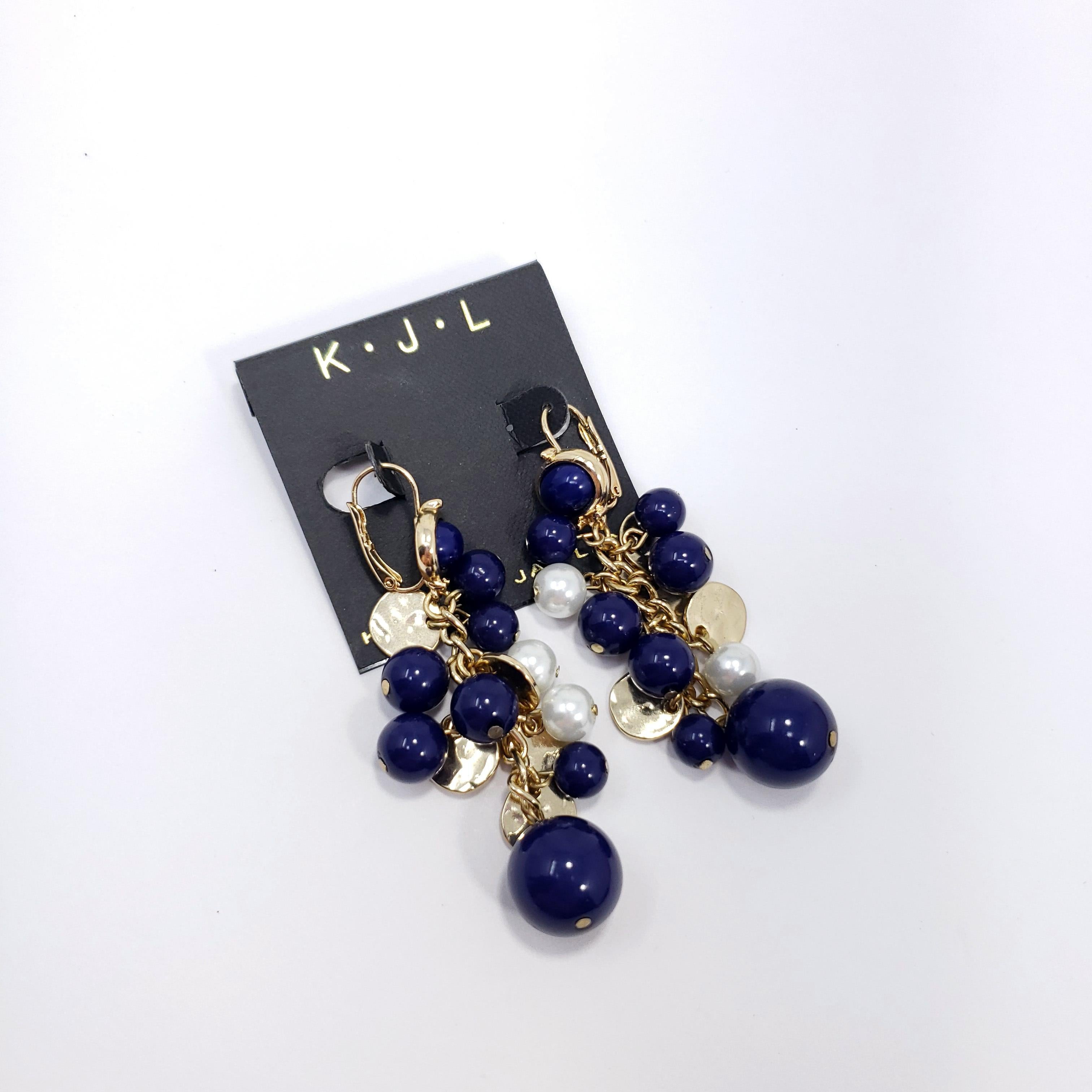 Stylish pair of cluster earrings by Kenneth Jay Lane. Add some glamour to any style with these gold-plated earrings decorated with faux lapis lazuli and pearl beads.

Hallmarks: Kenneth Lane