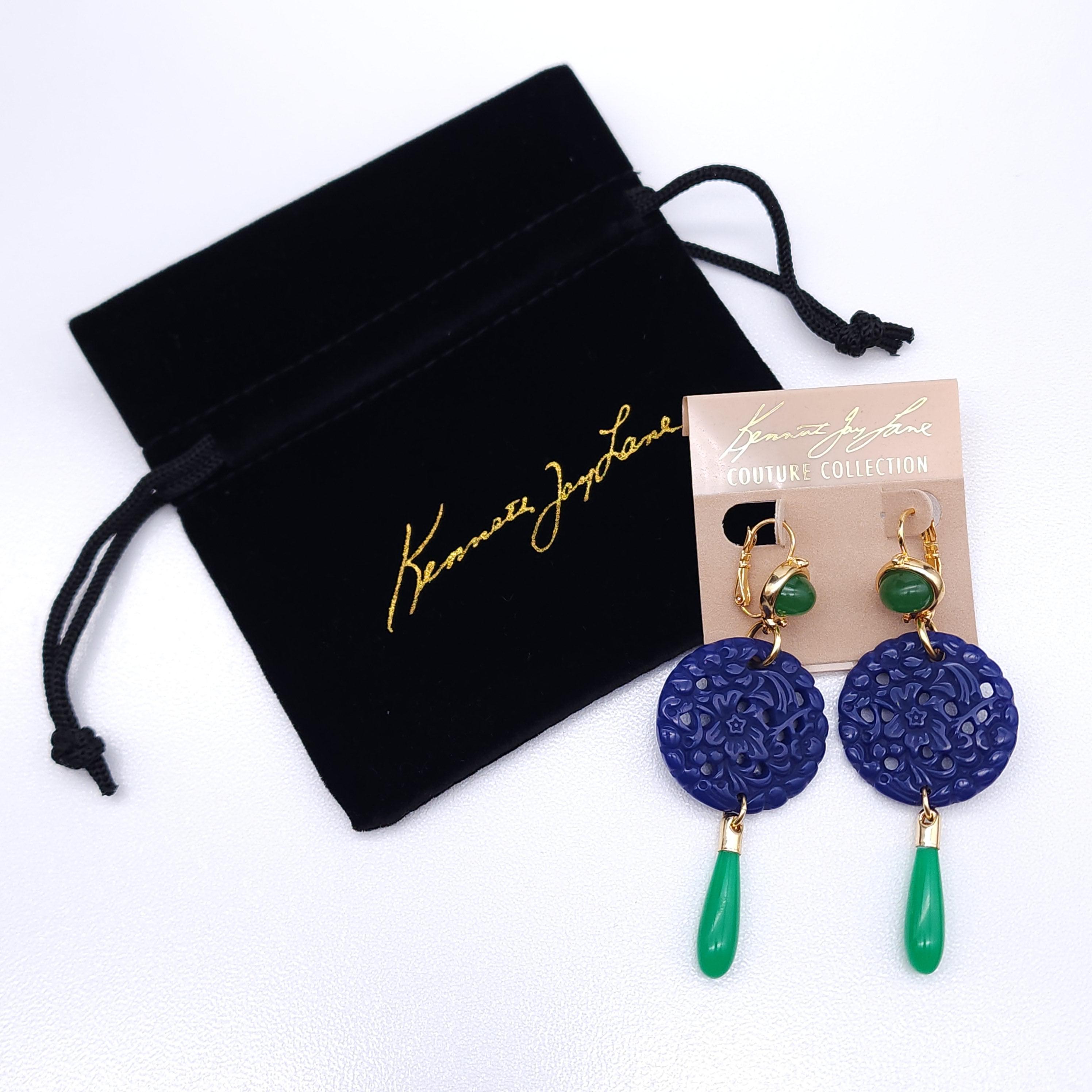Enhance your style with these Kenneth Jay Lane earrings from the Couture Collection! Featuring deep blue faux lapis lazuli round pendants with intricate patterns and vibrant jade green teardrop accents, these earrings make a striking statement. The