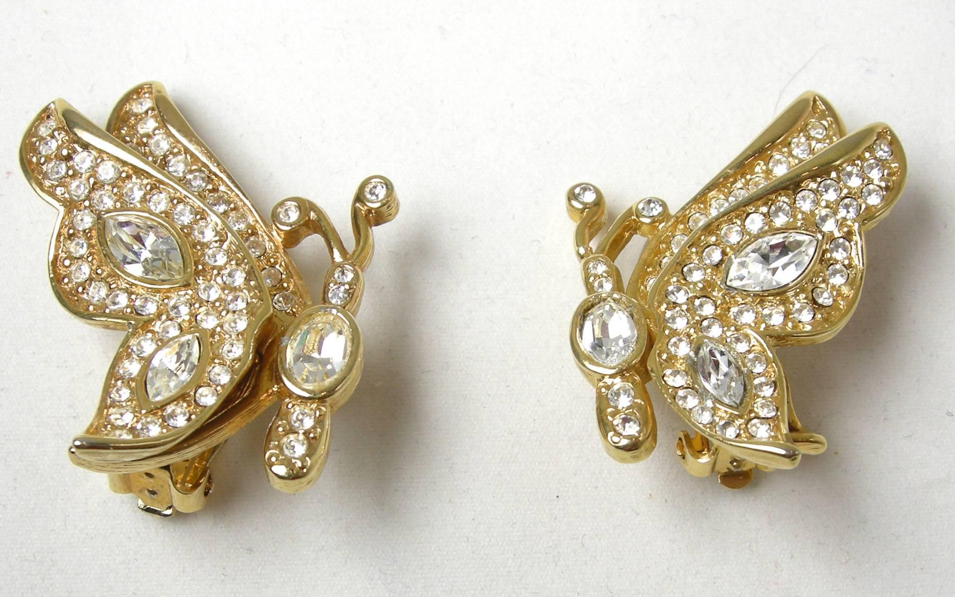 I love these clip earrings by Kenneth Jay Lane.  They are 3-dimensional butterflies in a gold tone metal setting and embedded with rhinestones throughout.  Larger tear shaped rhinestones accentuate the wings.  The body has an oval rhinestone along