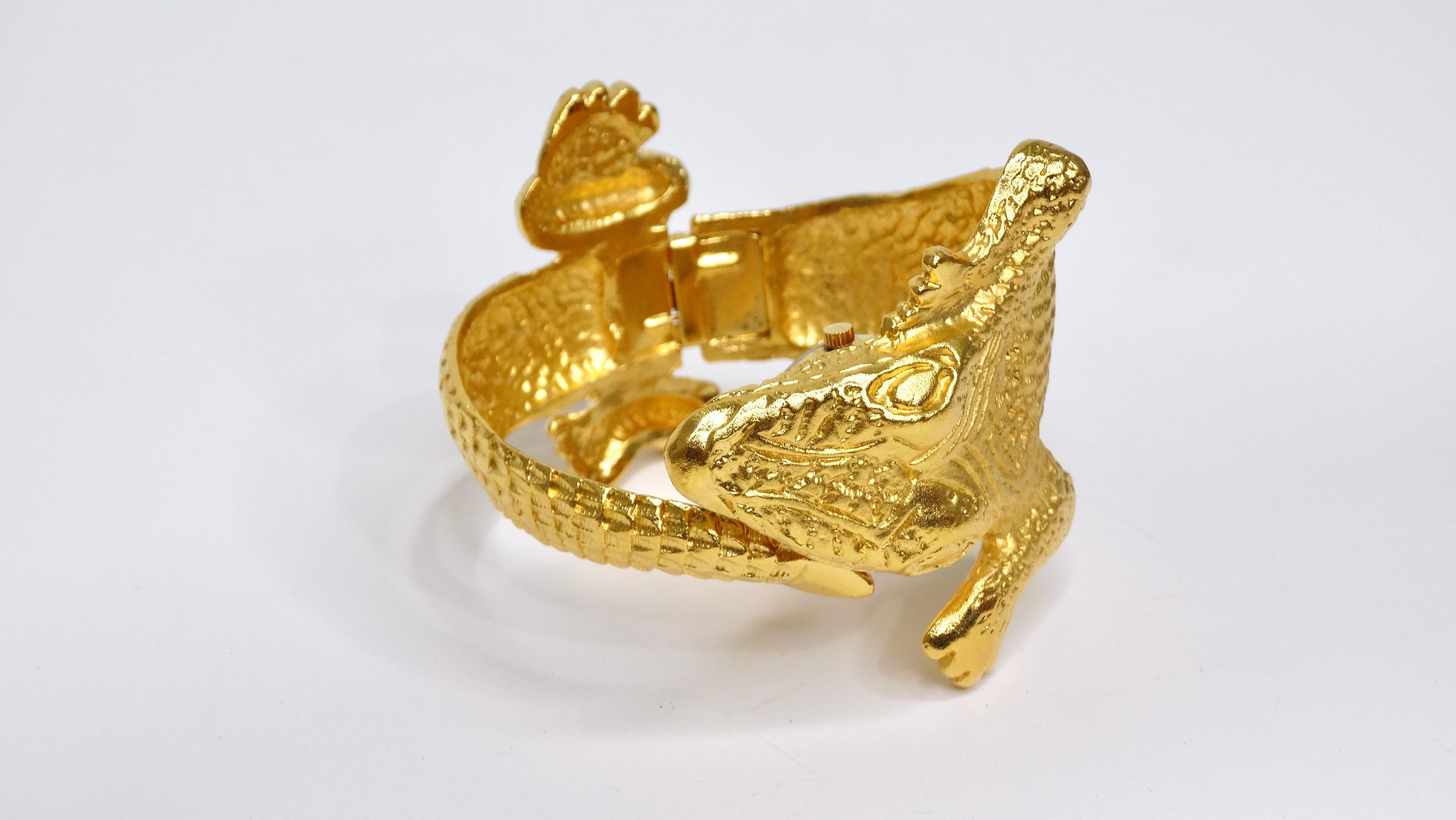 Kenneth Lane is known for his interesting and dramatic designs. This bracelet does just that. The bracelet depicts a full 3D body and head of an alligator in a radiant and rich gold and when pulled apart reveals a beautiful hidden stainless steel