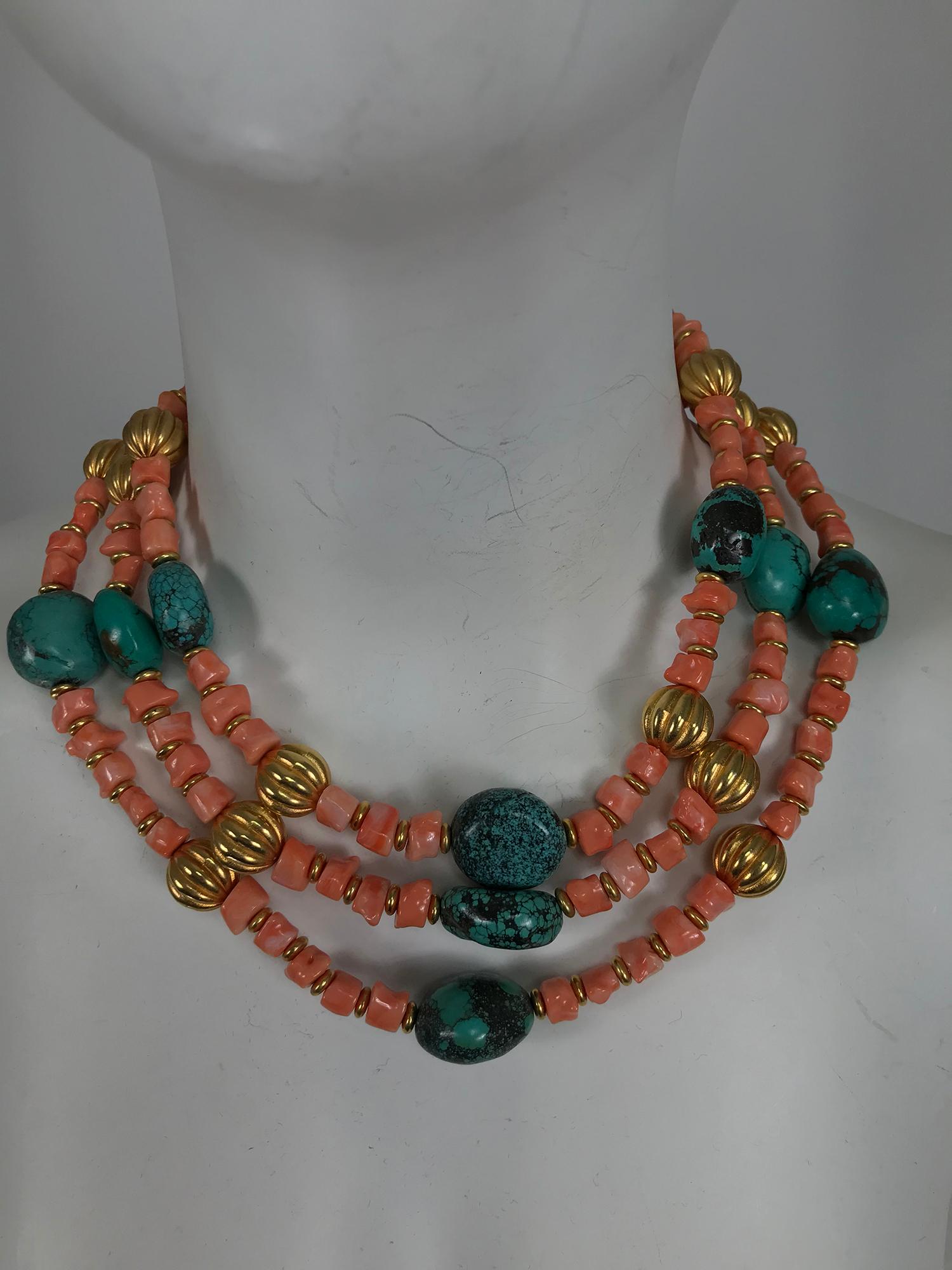 Kenneth Lane faux coral and turquoise with gold metal triple strand necklace. This beautiful three strand graduated bead necklace has faux coral with small gold metal beads between, there are larger gold beads between and lozenge shaped faux