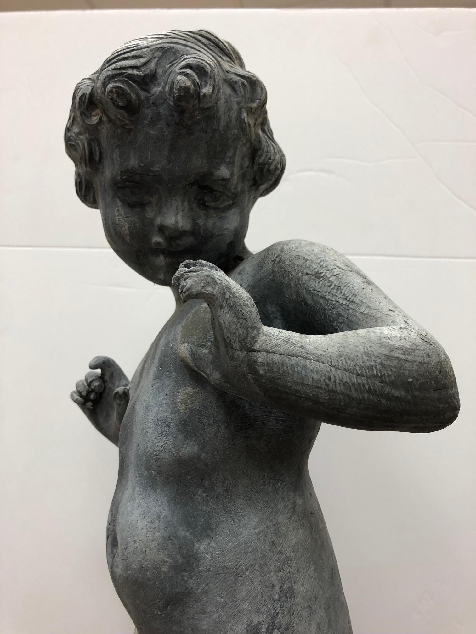 Statue of a young boy dancing made of lead by Kenneth Lynch and Sons' This is a beautiful statue of a young boy dancing and the details are amazing. He would look fantastic standing in a garden, edge of a pond or on top of a fountain.