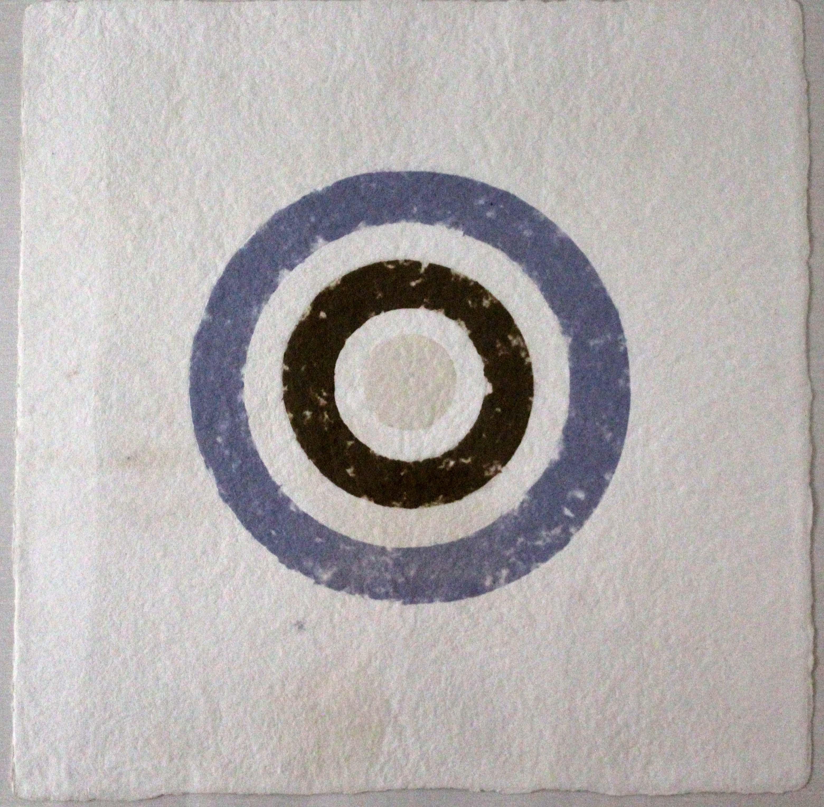 A bold contemporary statement - unique handmade rag paper with colored pulp - titled Target 1979 by American artist Kenneth Noland. Signed in pencil on the verso. The target composition is comprised of three colors (blue, brown, and cream). From the