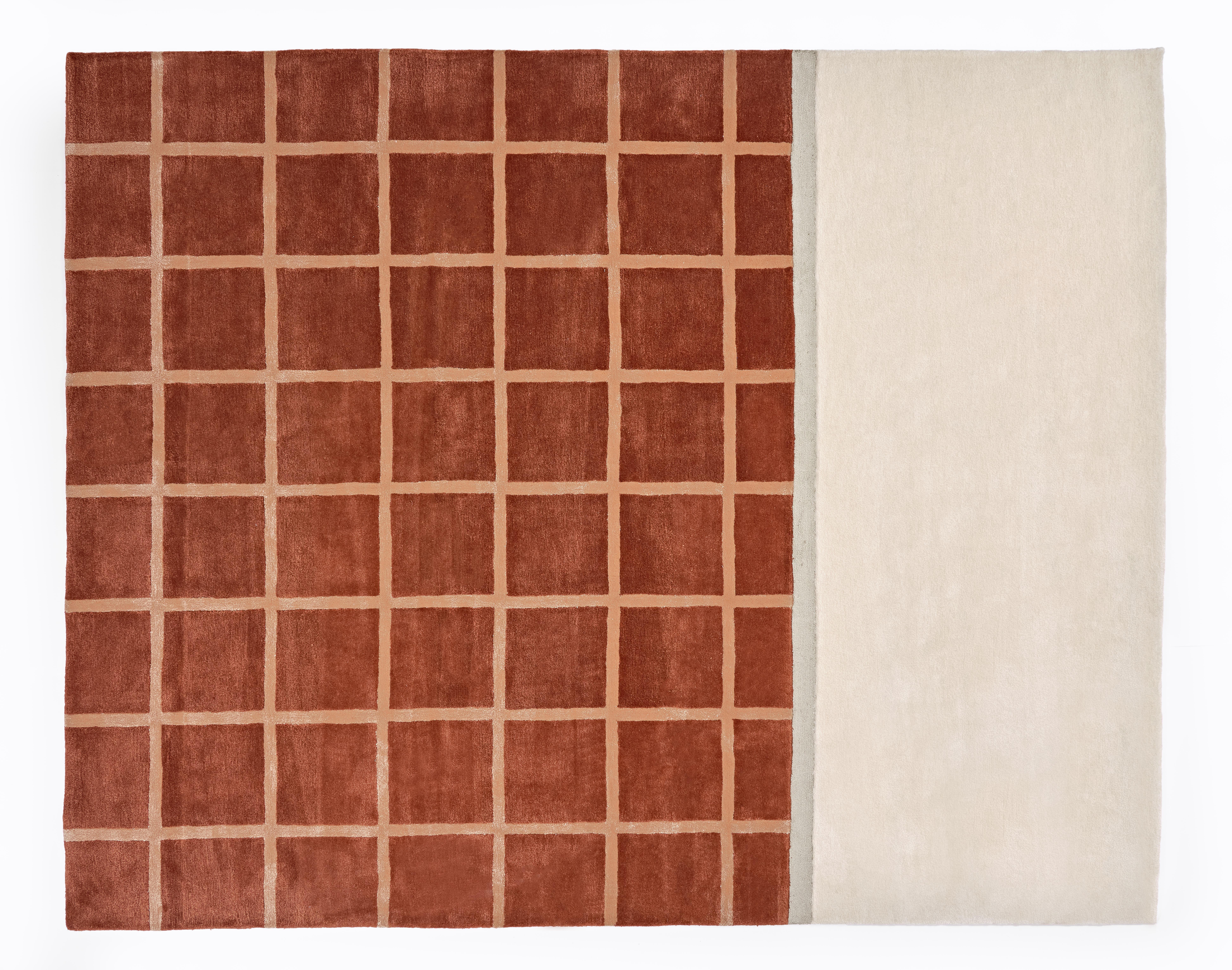 The Kenny rug features our signature grid pattern in a soft, modern color palette. Not another neutral to help ground a room. Rugs that make the room. Hand tufted rug made of a wool/viscose blend. Designed by Pieces.

Available in Garnet and