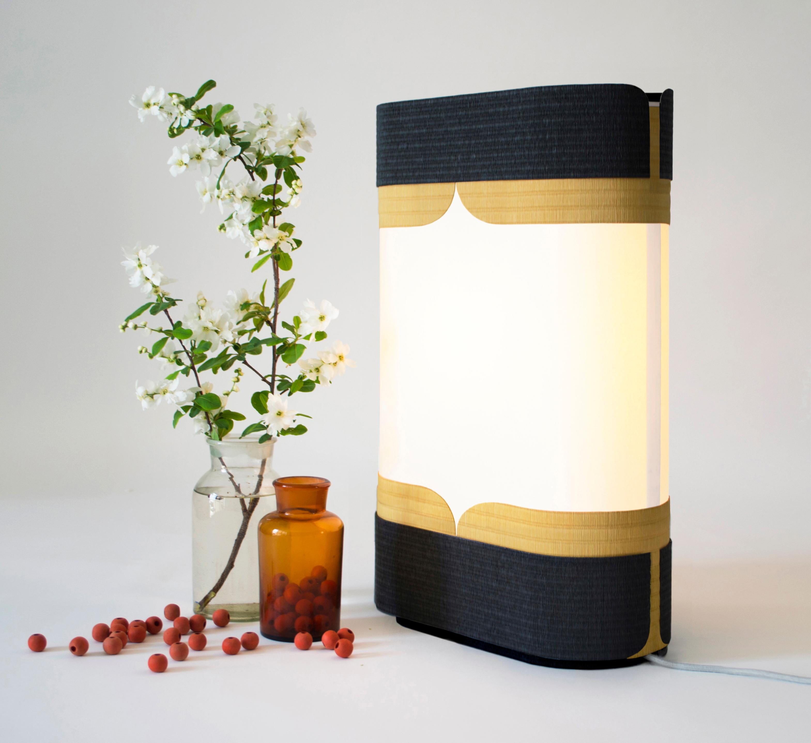 Kensho light by Astrid Hauton
Dimensions: W 37 x D 18 x H 59 cm
Materials: woven washi paper, waxed black Valchromat, polyphane, Japanese paper, removable cover in
opalescent plexiglass.

« Kensho », in Zen tradition, refers to the experience