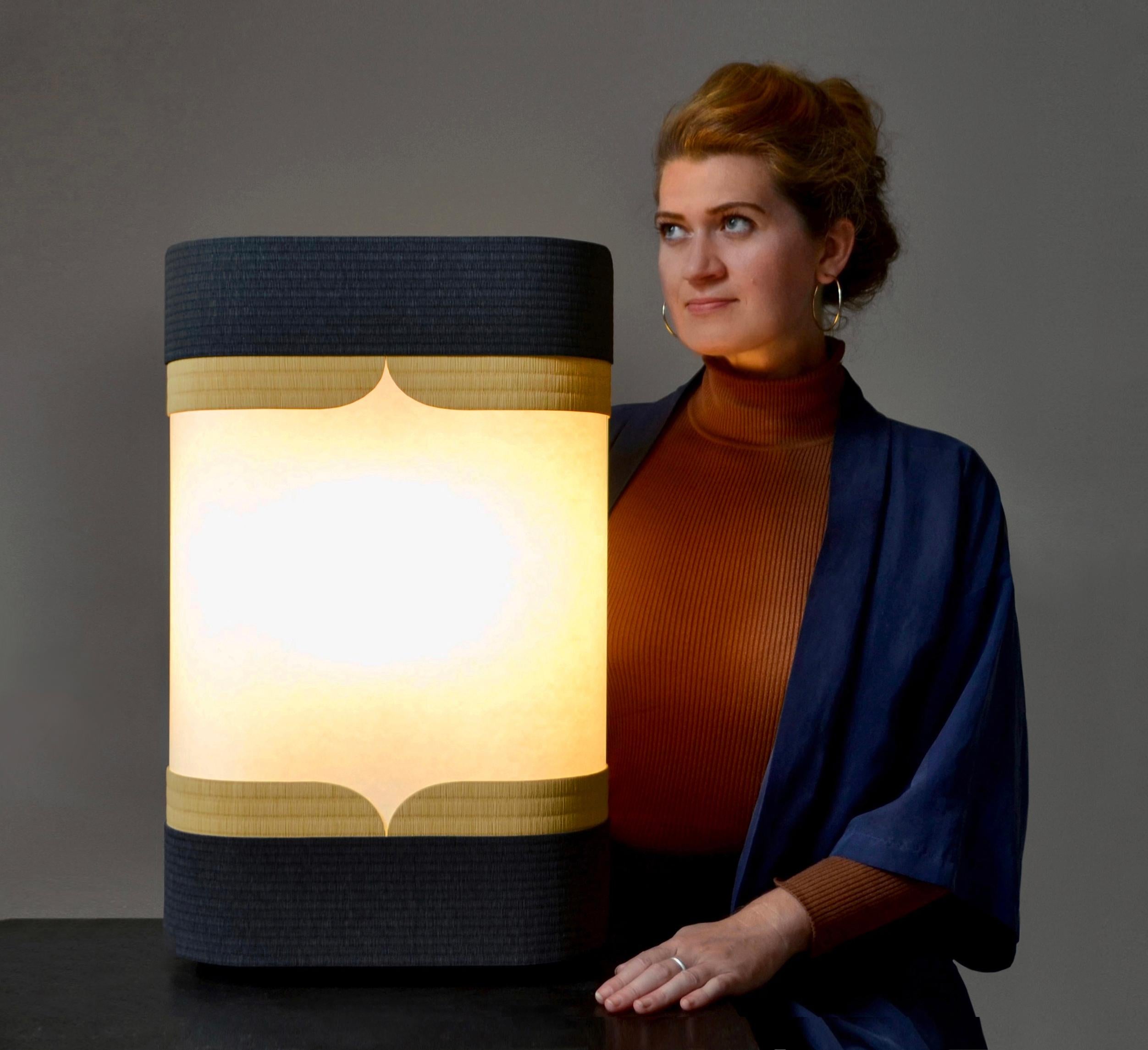 Kensho light by Astrid Hauton
Dimensions: W 37 x D 18 x H 59 cm
Materials: woven washi paper, waxed black Valchromat, polyphane, Japanese paper, removable cover in
opalescent plexiglass.

« Kensho », in Zen tradition, refers to the experience