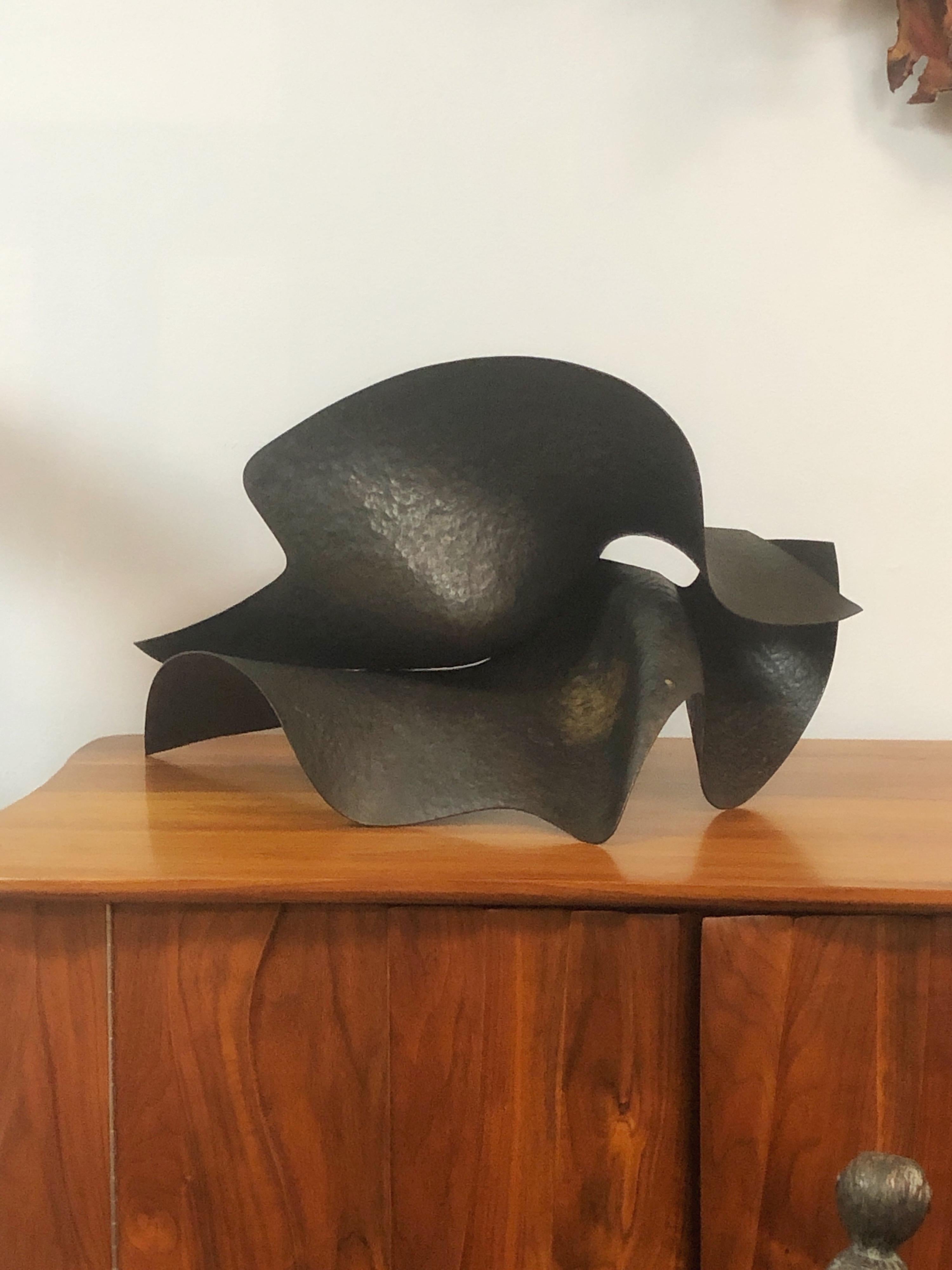 A wonderful sculpture by Kent Bloomer. Two sheets of hammered bronze. Comes with original walnut and acrylic base. 

 Kent Bloomer is known for monumental public sculpture and for philosophical exploration of the relationship between sculpture,