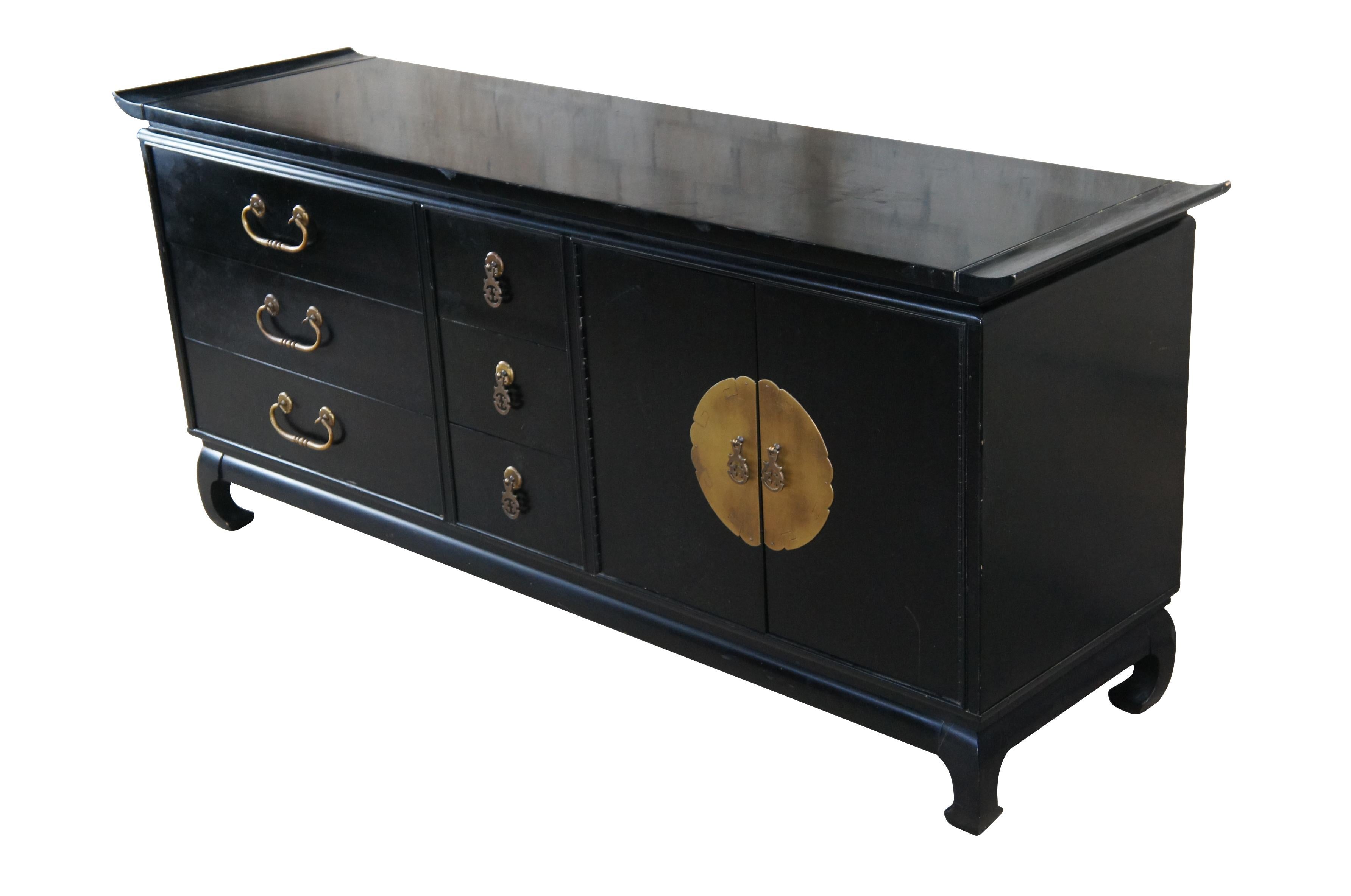 Mid century modern Kent Coffey Amerasia collection black lacquered sideboard / buffet / credenza / console or dresser featuring chinoiserie styling with nine drawers, flared top, brass hardware and ming style feet.

 The Kent-Coffey Manufacturing