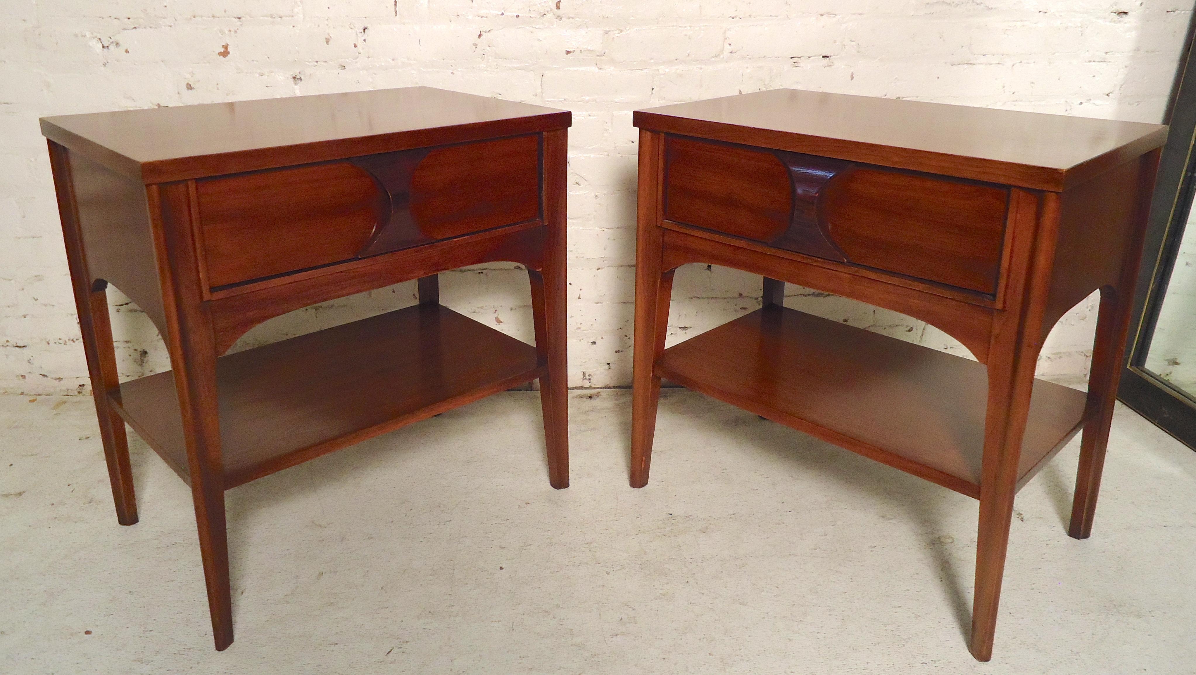 Pair of mid-century modern nightstands by Kent Coffey for their Perspecta line. Warm walnut grain, single drawer with sculpted wood handle and bottom shelf.
(Please confirm item location - NY or NJ - with dealer).
  