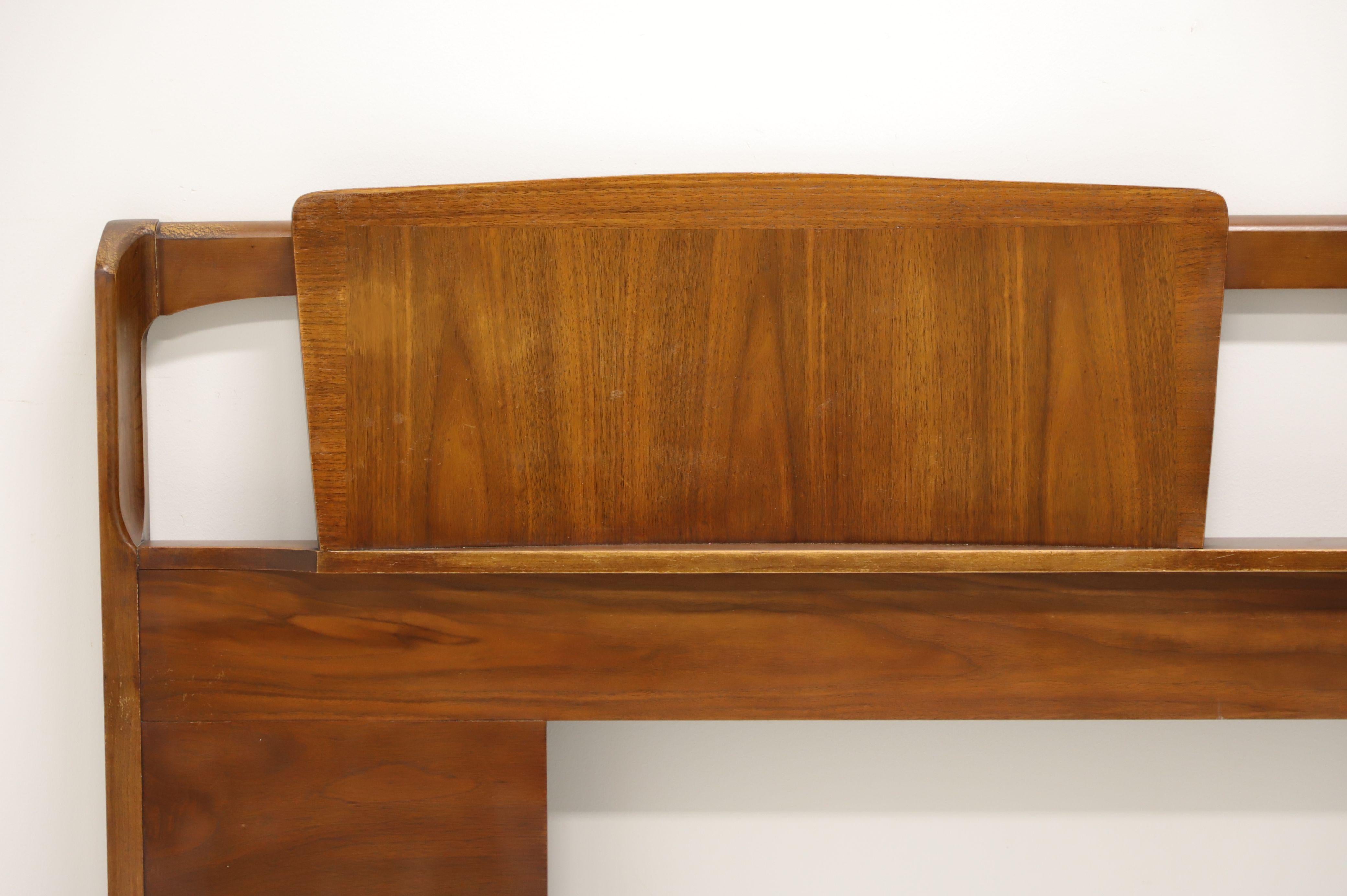 A Mid Century Modern king size headboard by Kent Coffey, of Lenoir, North Carolina, USA, from their Impact line. Solid walnut with banded dual panel headrest panels and metal brackets for attaching to a frame. Made in the mid 20th Century. 

Style