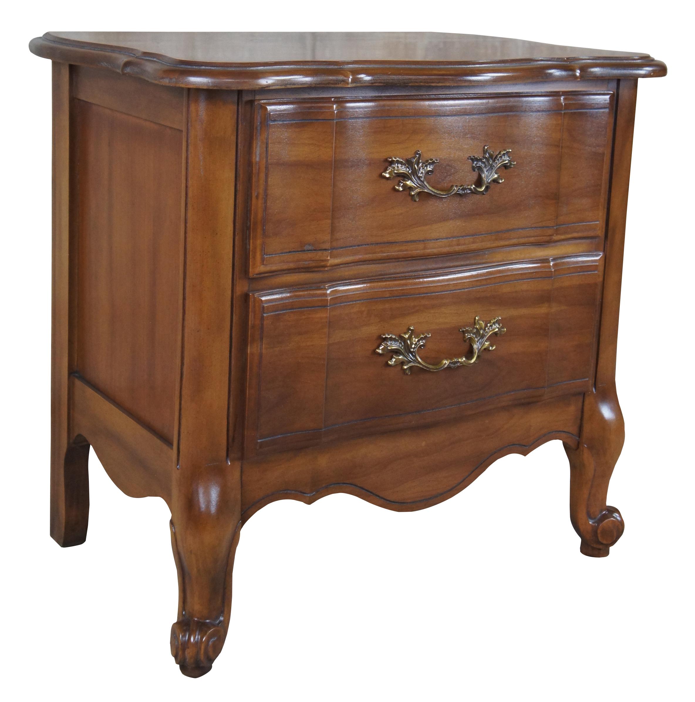 Vintage nightstand or dresser by Kent Coffey. From the Marquee French collection, featuring French Provincial styling with scalloped / serpentine top over two drawers and scrolled cabriole feet. 300-310.
 