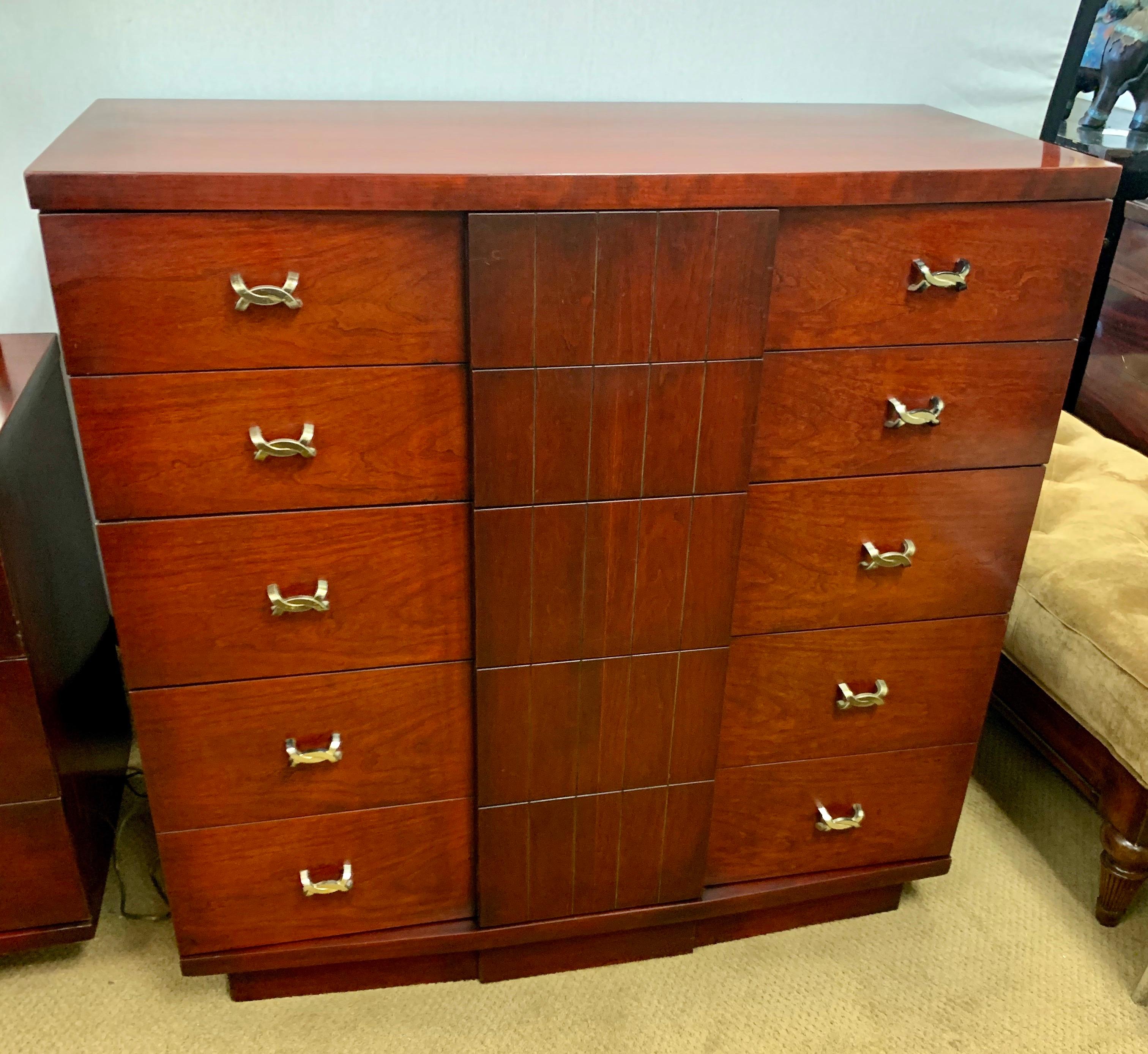 Iconic, signed midcentury Classic from Kent Coffey. This is part of the coveted titan line. Made in the USA and featuring nine drawers, all adorned with sought after X-pulls which are all original.