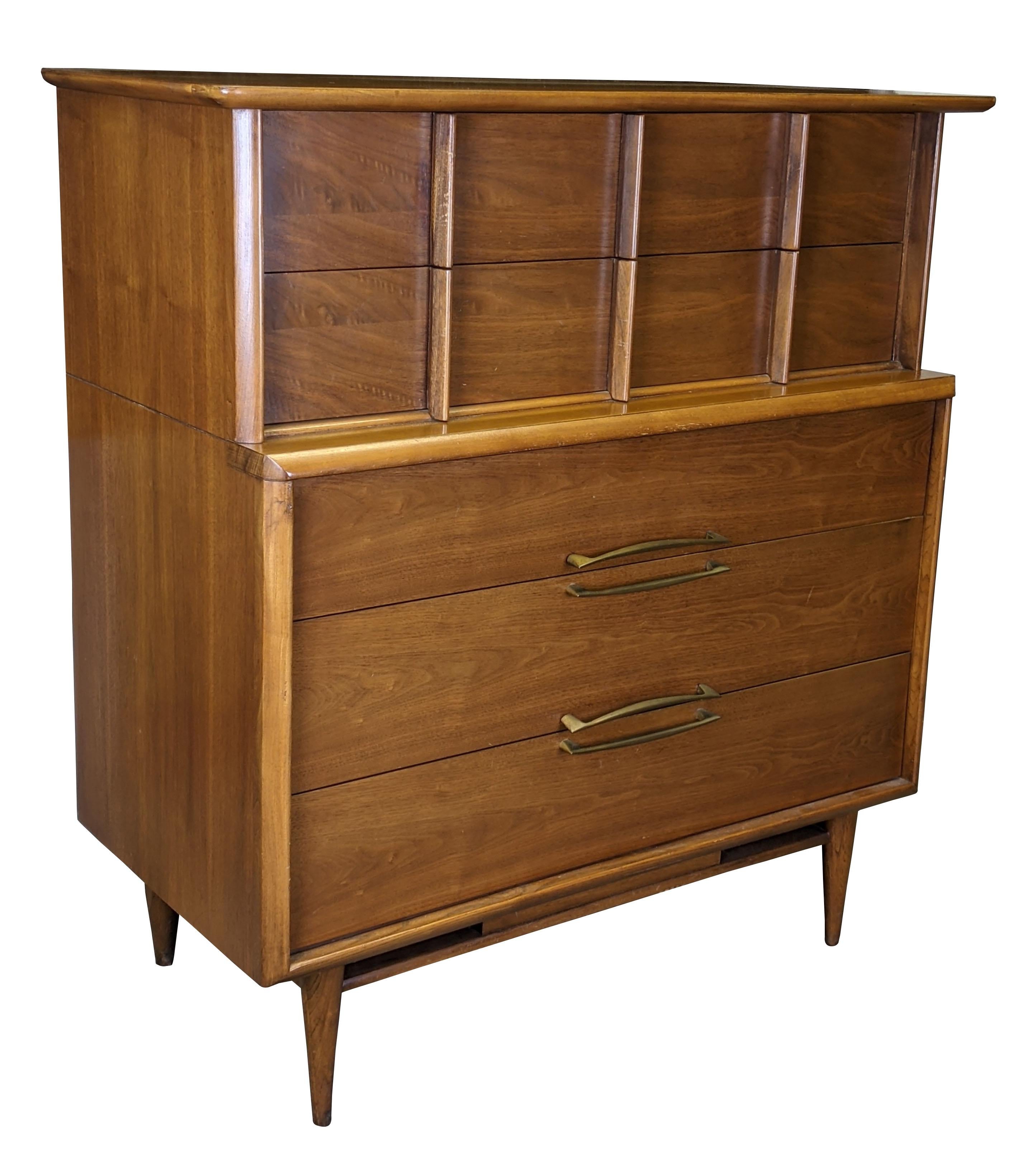 Vintage scuptural shaped dersser by Kent Coffee. Made from continiental walnut with dovetailed drawers and tapered legs. Circa 1960s. #6900.
     