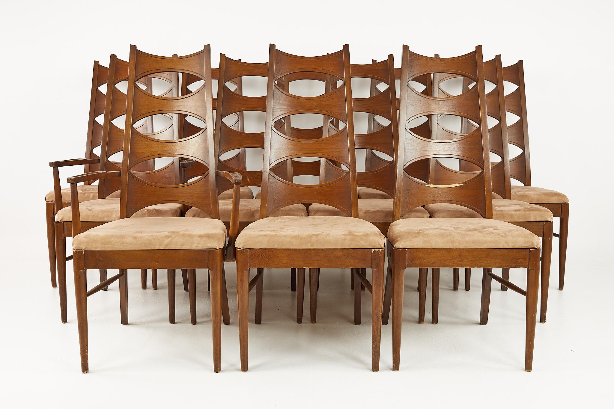Kent Coffey Perspecta mid century cats eye walnut dining chairs - set of 12

Each chair measures: 19.5 wide x 18.5 deep x 45 inches high, with a seat height of 19 and arm height of 26 inches

Each captain chair measures 22.5 wide x 18.5 deep x