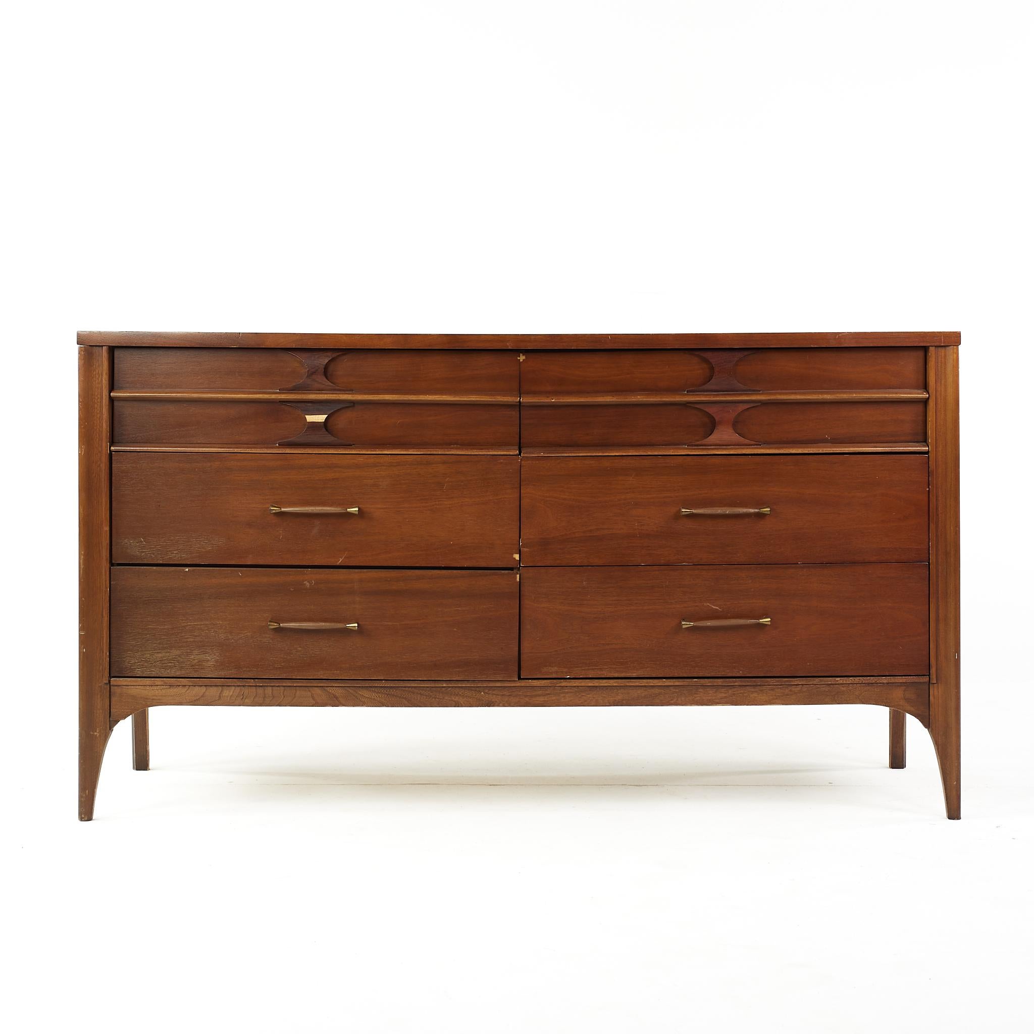 Kent Coffey Perspecta mid century walnut and rosewood 6 drawer lowboy dresser

This lowboy dresser measures: 56 wide x 19 deep x 31 inches high

All pieces of furniture can be had in what we call restored vintage condition. That means the piece