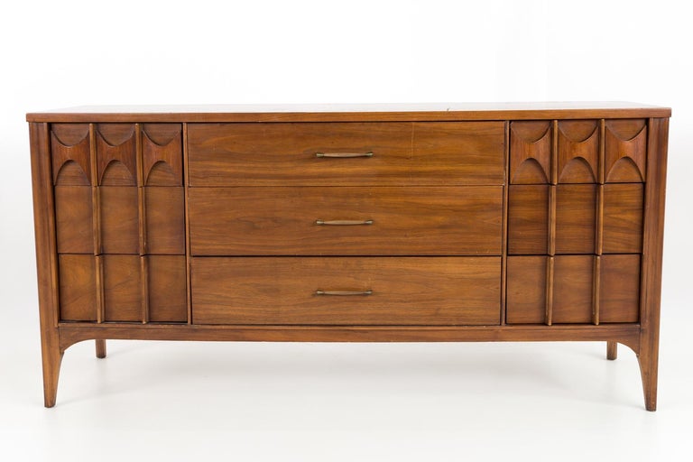 Kent Coffey Perspecta mid-century walnut and rosewood 9 drawer lowboy dresser.

This lowboy measures: 64 wide x 19 deep x 31 inches high.

All pieces of furniture can be had in what we call restored vintage condition. That means the piece is