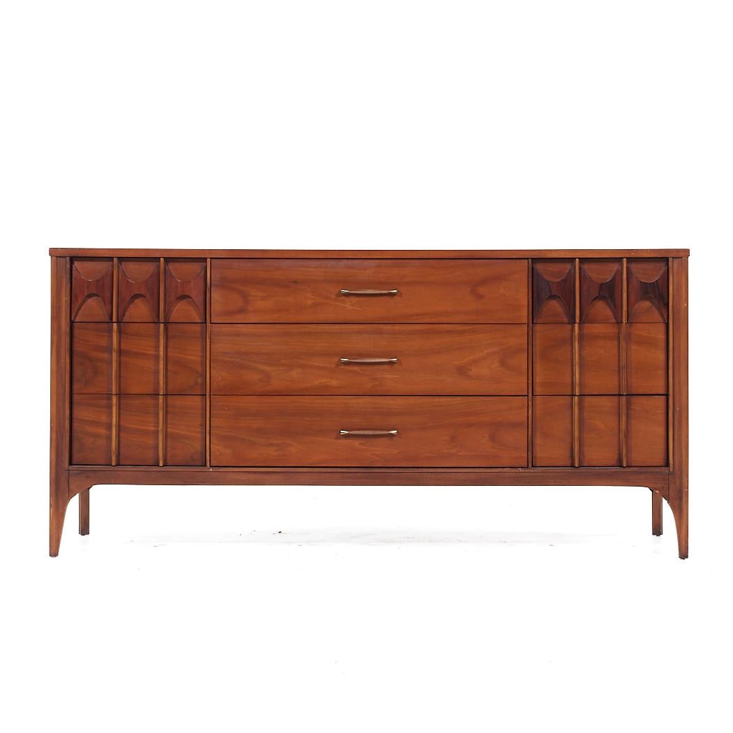 Kent Coffey Perspecta Mid Century Walnut and Rosewood 9 Drawer Lowboy Dresser

This lowboy measures: 64 wide x 19 deep x 31 inches high

All pieces of furniture can be had in what we call restored vintage condition. That means the piece is restored