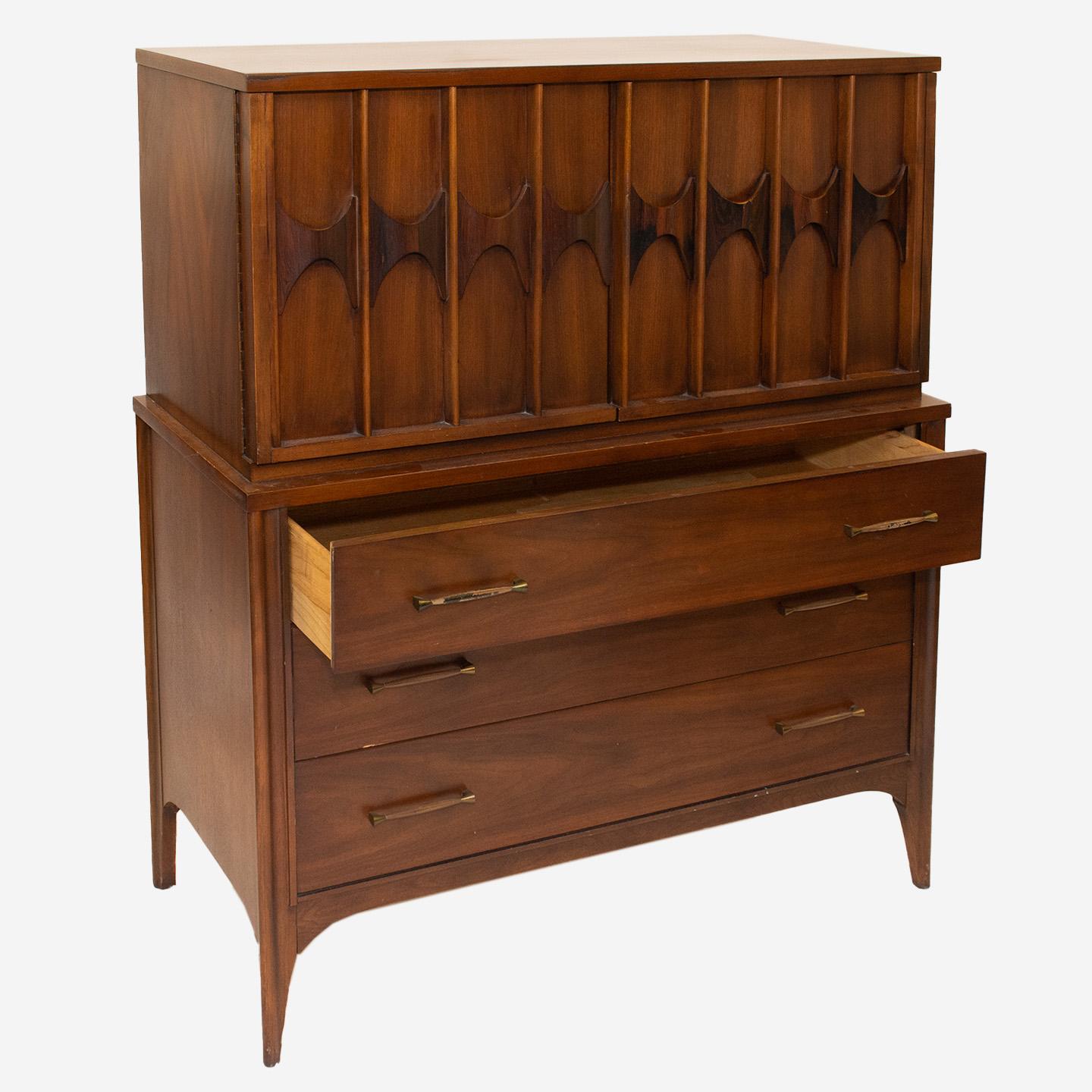 Offering a sweet piece of nostalgia with this iconic Kent Coffey Perspecta midcentury Armoire/Highboy. Started in 1907 in North Carolina, the Kent Coffey company rose in popularity in the 1950s and 60s. Furniture pieces like this dresser became very