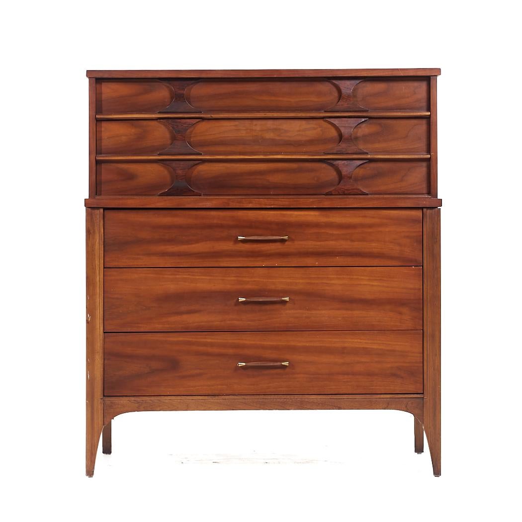 Kent Coffey Perspecta Mid Century Walnut and Rosewood Highboy Dresser

This highboy measures: 40 wide x 19.25 deep x 46 inches high

All pieces of furniture can be had in what we call restored vintage condition. That means the piece is restored upon