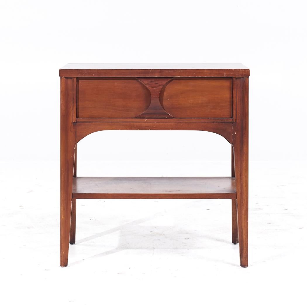 Kent Coffey Perspecta Mid Century Walnut and Rosewood Nightstand

This nightstand measures: 23 wide x 15 deep x 24.25 inches high

All pieces of furniture can be had in what we call restored vintage condition. That means the piece is restored upon