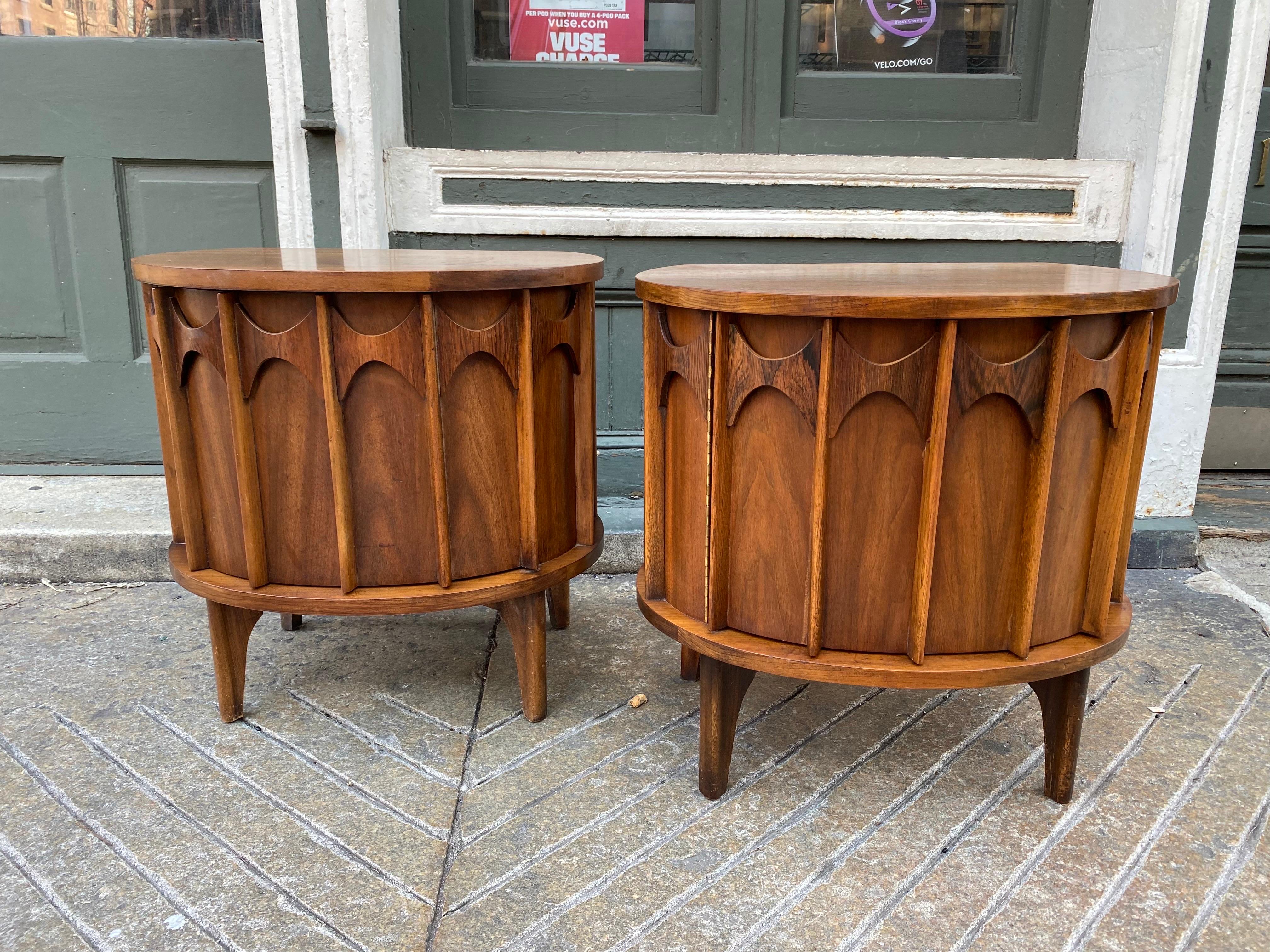 Kent Coffey Perspecta pair of walnut and rosewood nightstands. Unique and uncommon design! Good Original Condition, one nightstand shows mopre wear to top surface, probably the Husband's side! Overall in good Shape. Door swings open to reveal