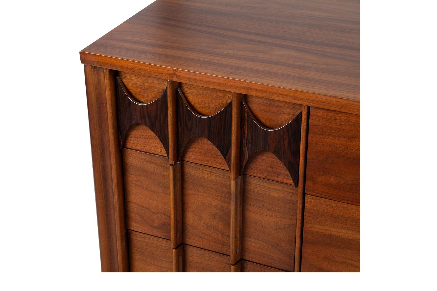 Mid-century modern long dresser by Kent Coffey. Minimalist Danish Modern inspired profile. A handsome example of American craftsmanship. Stunning walnut dresser with rosewood accents. Dresser has incredible lines and detailing. Exquisitely designed