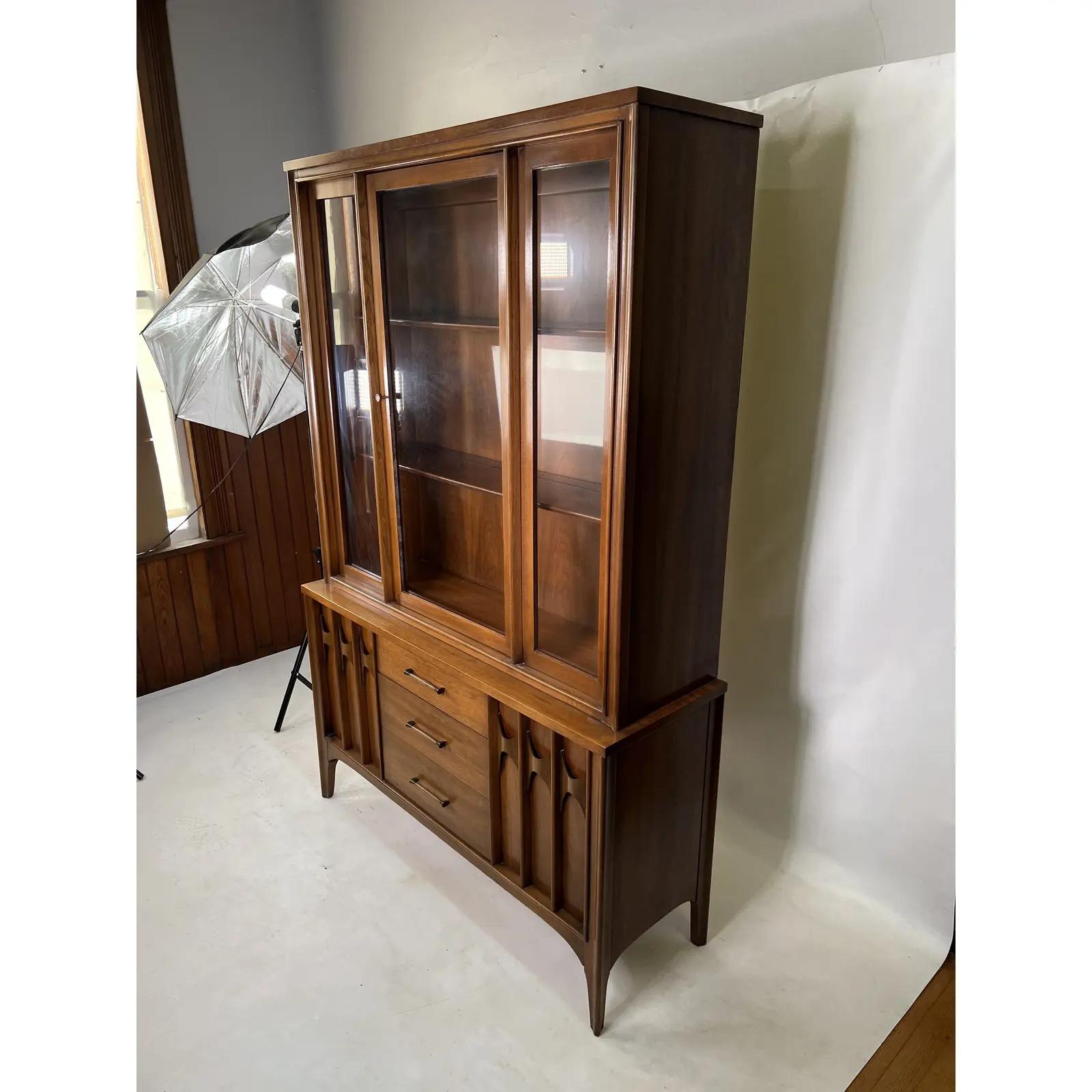 This beautiful Kent Coffey Perspecta hutch is made out of walnut and rosewood. This hutch is the smaller version and was manufactured in one piece.
