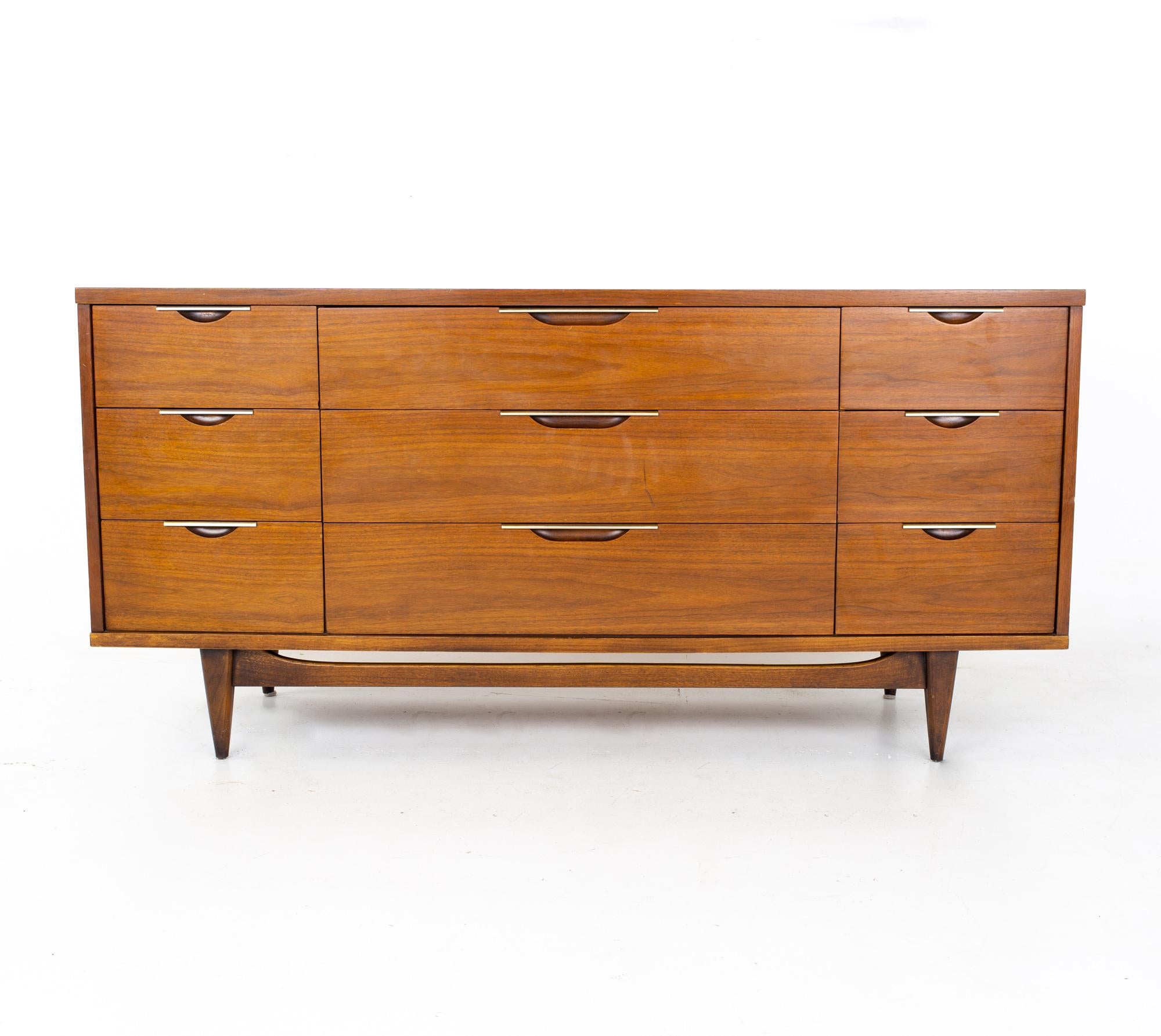 Kent Coffey Tableau mid century walnut and laminate 9 drawer lowboy dresser

The dresser measures: 64.25 wide x 19.25 deep x 31.5 inches high

All pieces of furniture can be had in what we call restored vintage condition. That means the piece is