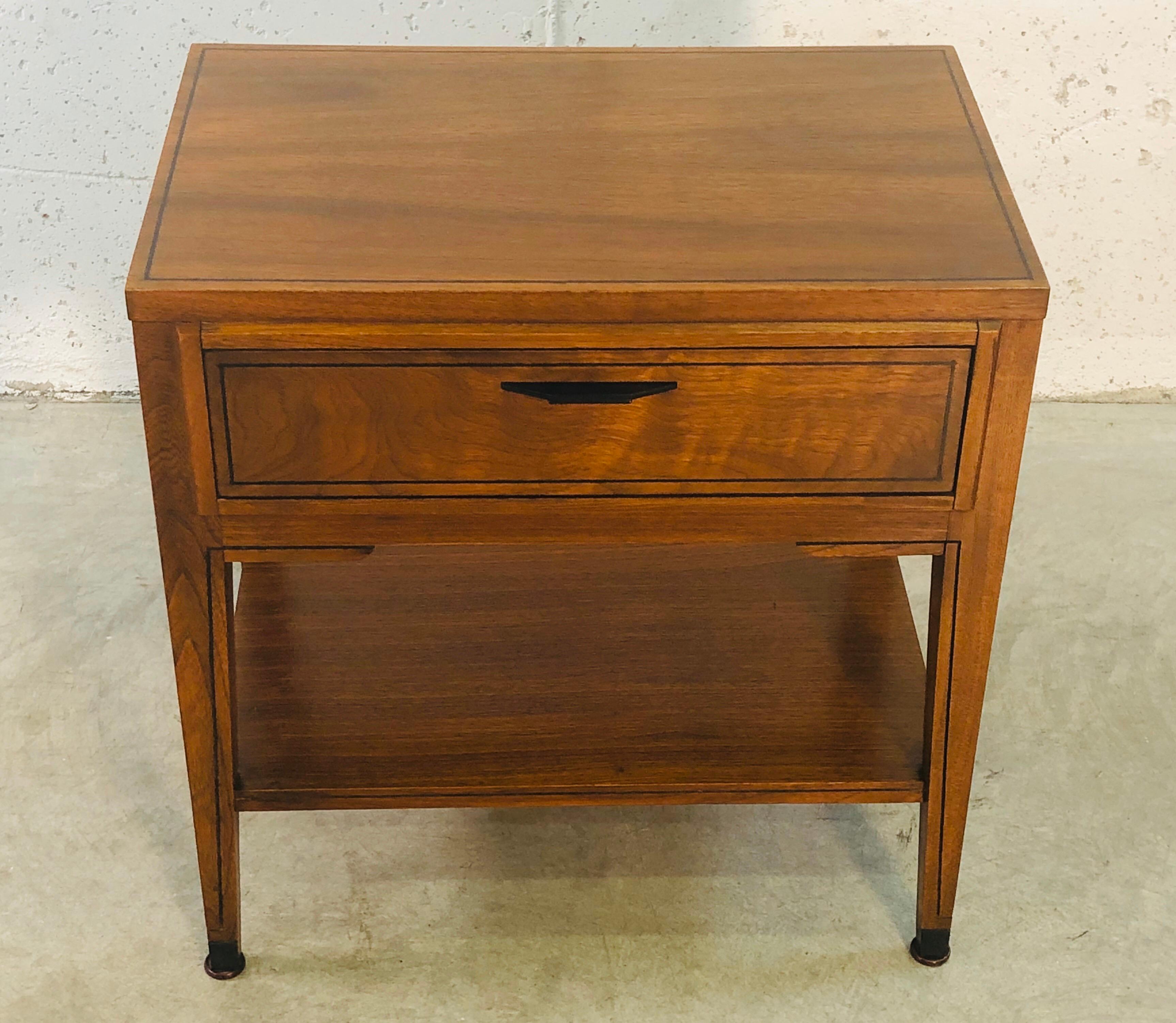 Vintage 1960s Kent Coffey walnut wood night stand with a single drawer. Comes with an open shelf underneath. Excellent condition. Metal handle has been refinished. Marked inside.