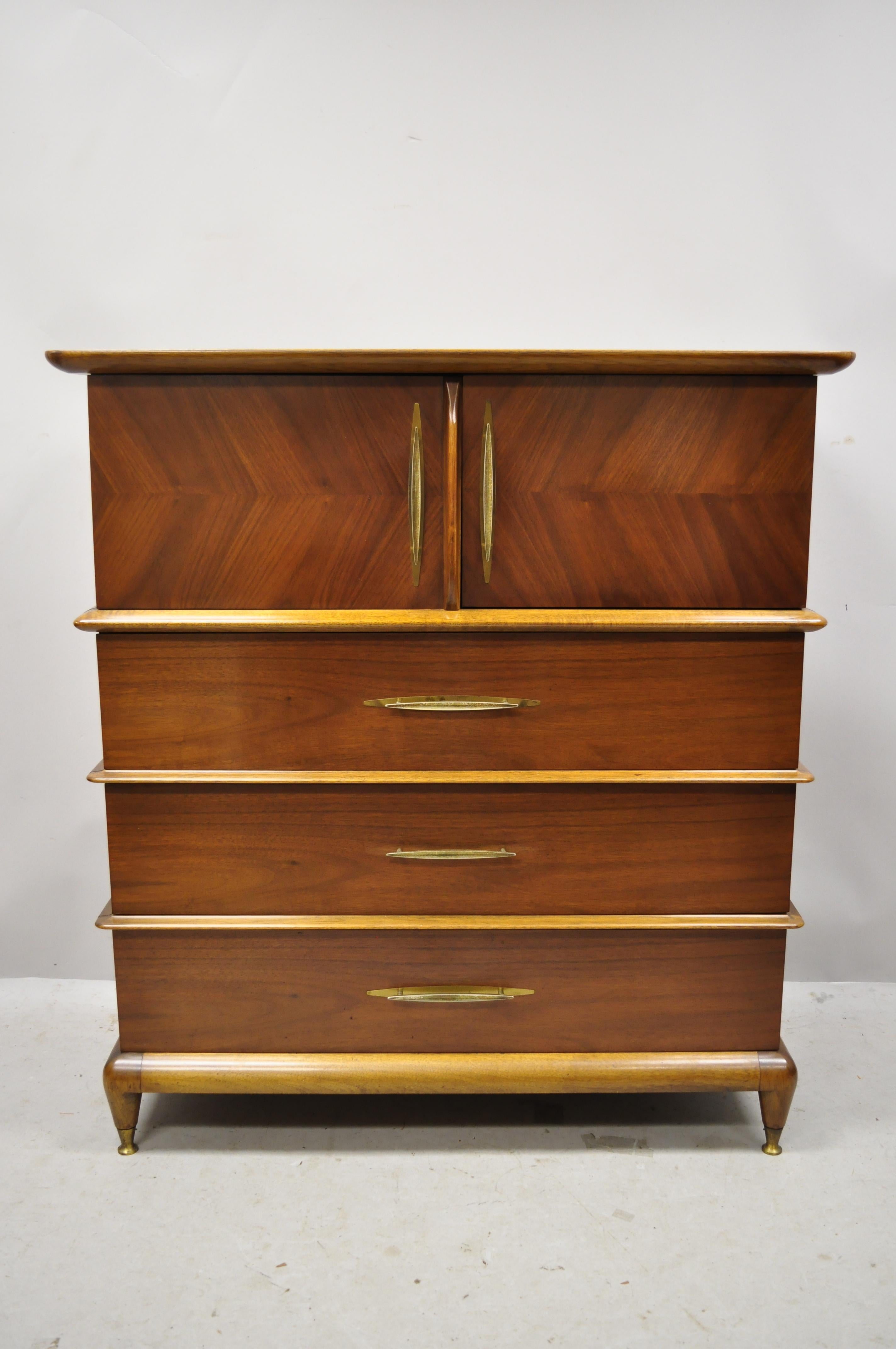 Kent Coffey the appointment Mid-Century Modern sculpted walnut tall chest dresser highboy. Item features brass capped feet, sculpted wood frame and trim, solid wood construction, beautiful wood grain, 2 swing doors, original stamp, 3 dovetailed