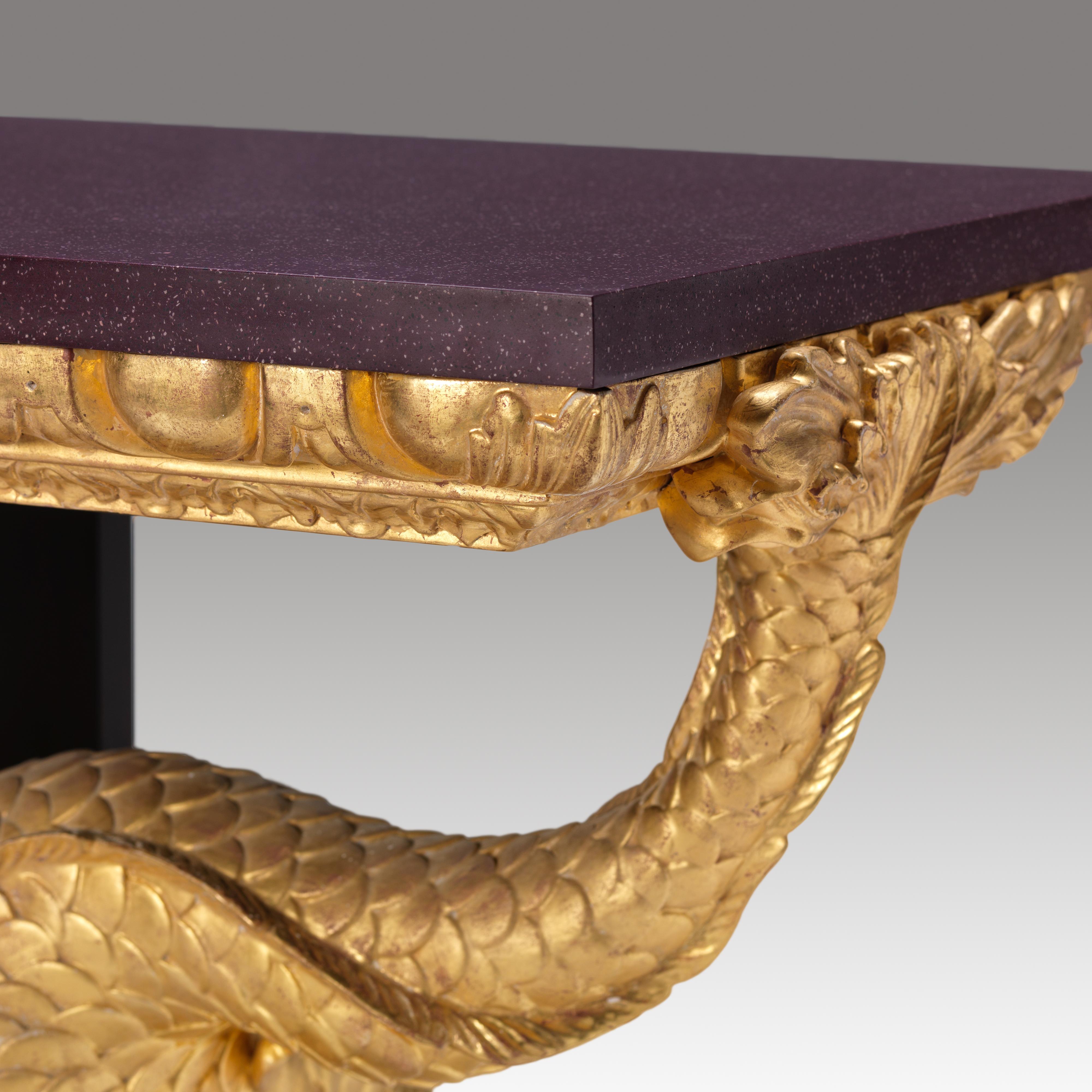 A fine William Kent dolphin pier console table with scagliola porphyry top. Resting upon an egg-and-dart frieze supported by a trio of stylised Kentian dolphins upon a faux porphyry carved step work plinth.

Bespoke sizing, design adaptations and