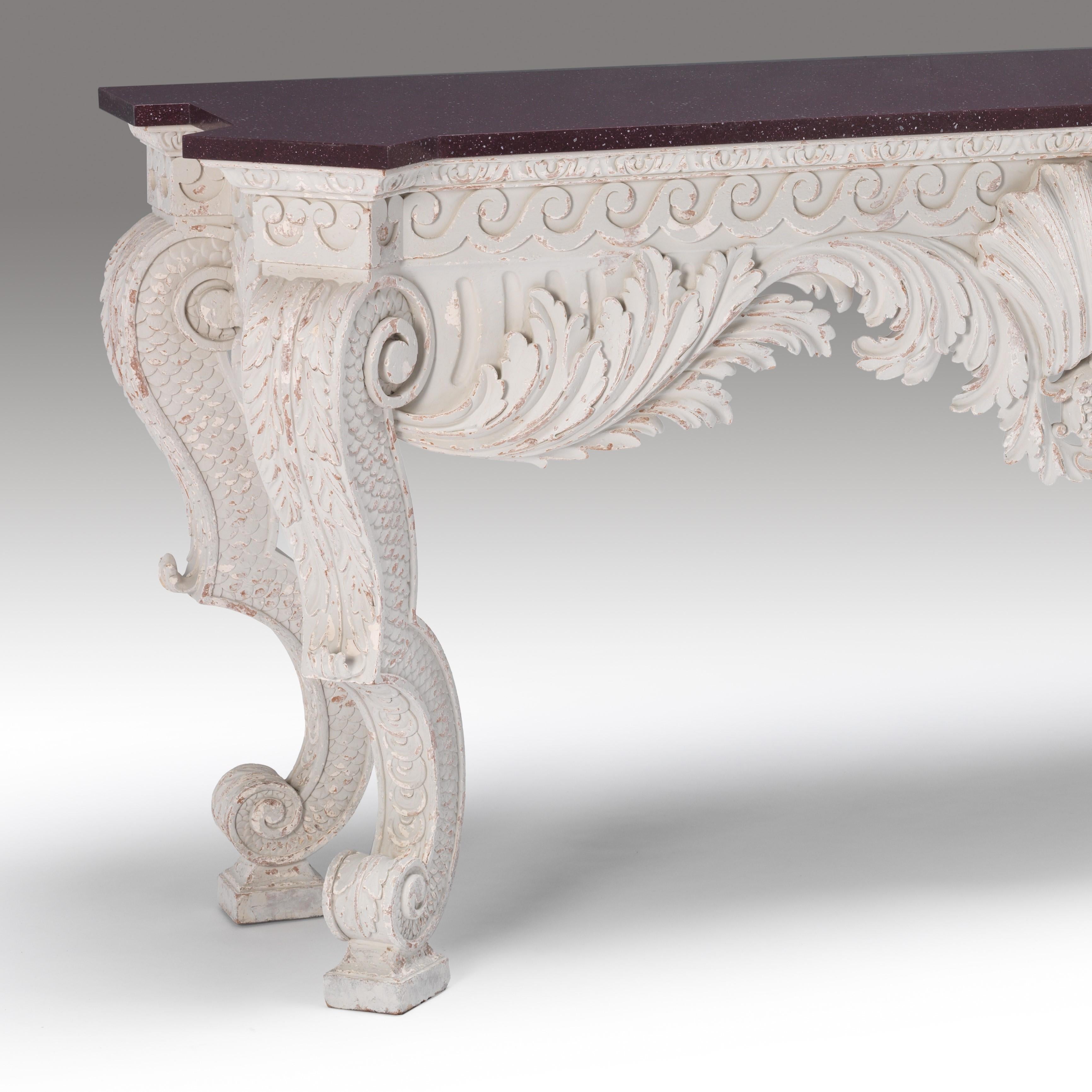 A finely carved wood and aged gesso fish scale leg decorated hall/console table, the design of classic William Kent form. Shown with a faux porphyry decorated top. Can be supplied with marble top if required. The table frame itself finished in