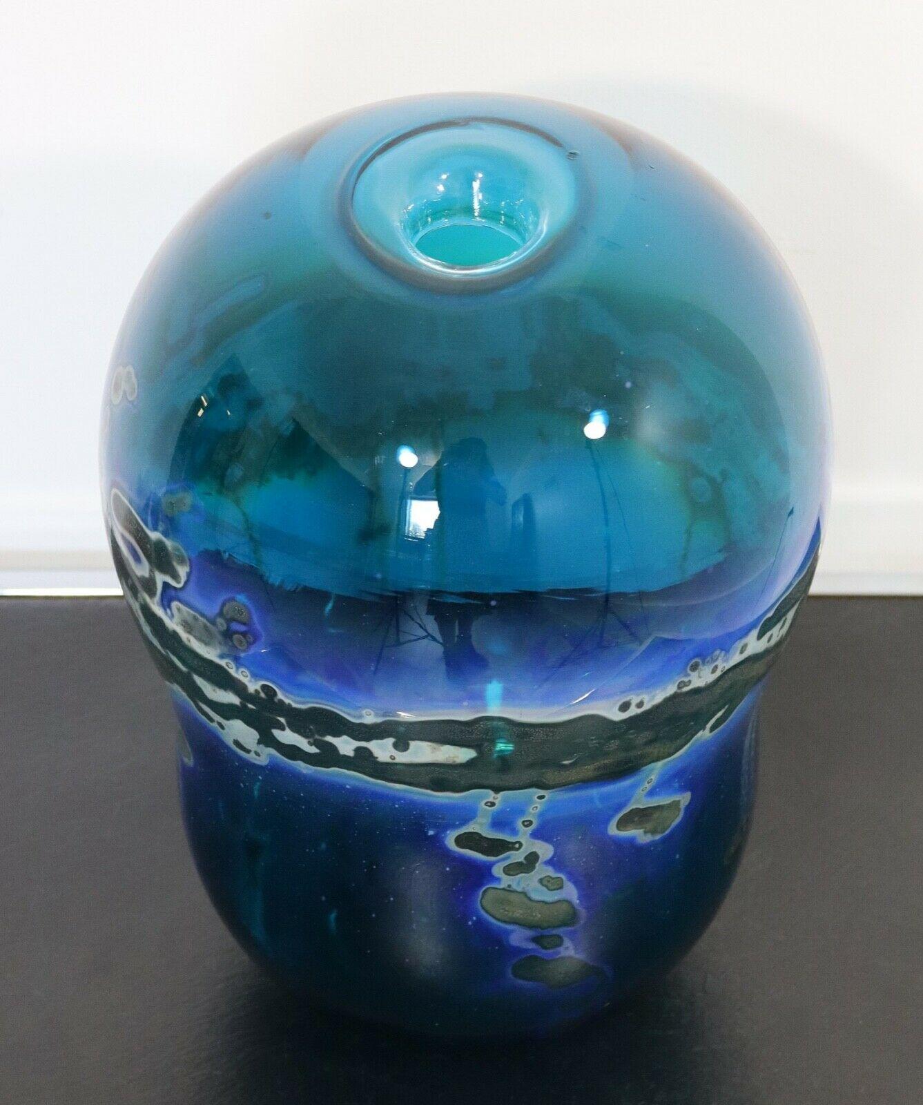 For your consideration is a stunning blue hand blown glass vase with swirl designs, signed by Kent Ipsen (14x10). This is from the private collection of John Loree, who was a beloved and inspirational ceramics professor at Eastern Michigan