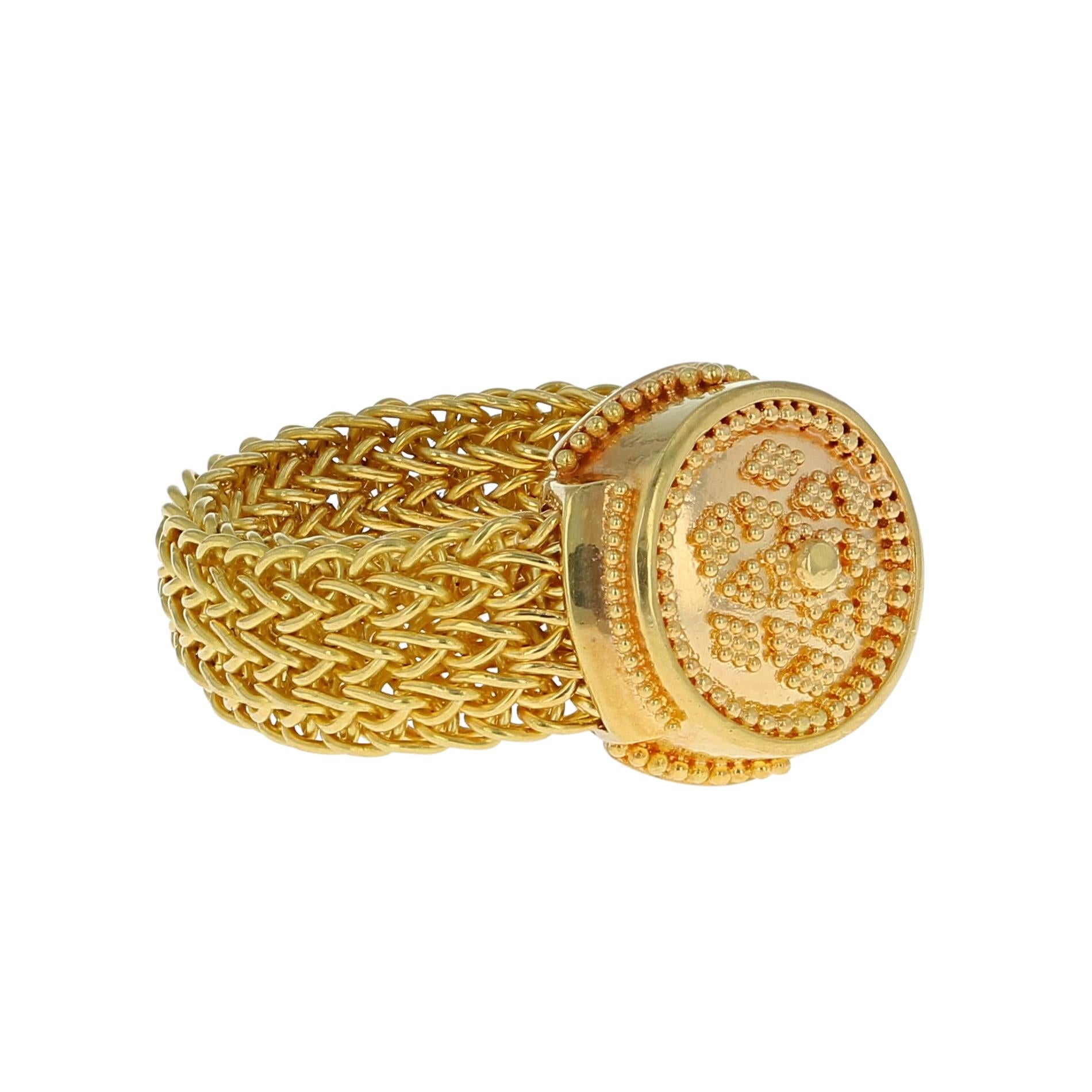 A unique ring design from the Kent Raible 'Studio Collection'! This ring features the Raible classic gold granulation, but uses a flexible mesh, hand woven chain band! 

Unlike much “designer” jewelry made today, all jewelry work is done under