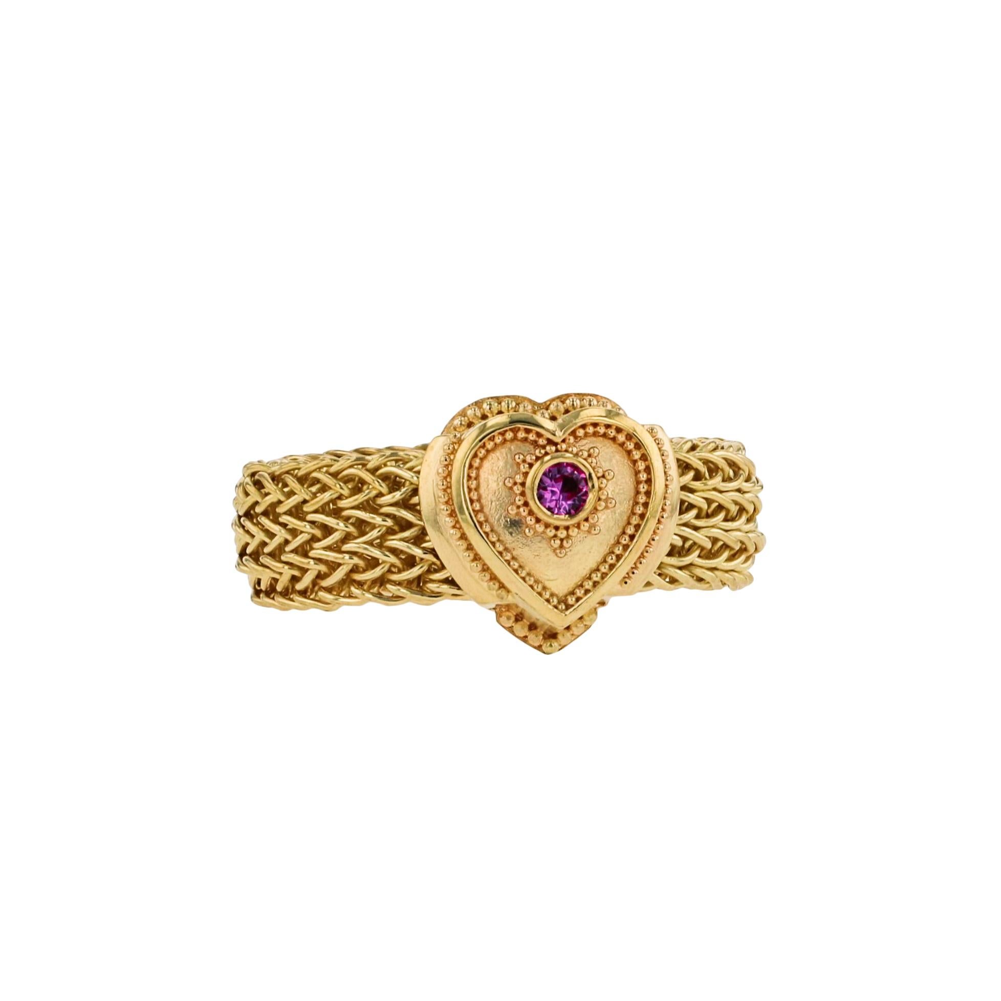 Show your love with Kent Raible's heart shaped ring set with a lovely Pink Sapphire! This solitaire ring features Raible's fine granulation, and a flexible hand woven chain band!

Pink Sapphire .07ct
9.8 grams 18 karat Gold

Size 8 1/4
This ring is