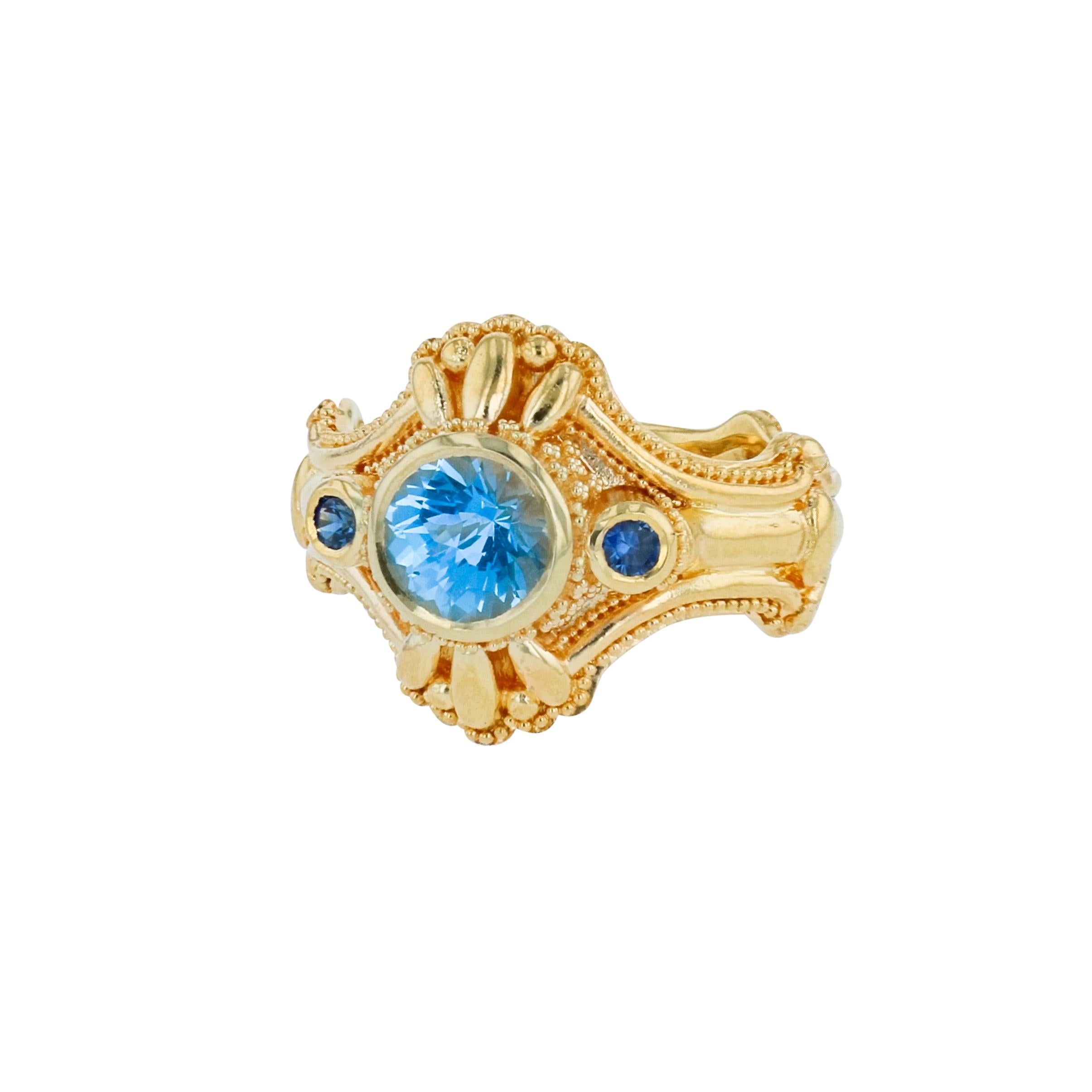 Kent Raible's Aquamarine and Blue Sapphire Three-Stone Ring has all the unique and wonderful Raible trademarks... Beautiful intricate detailing, all accented with fine granulation! 

Size 6.4
This ring is sizable

Unlike much “designer” jewelry made