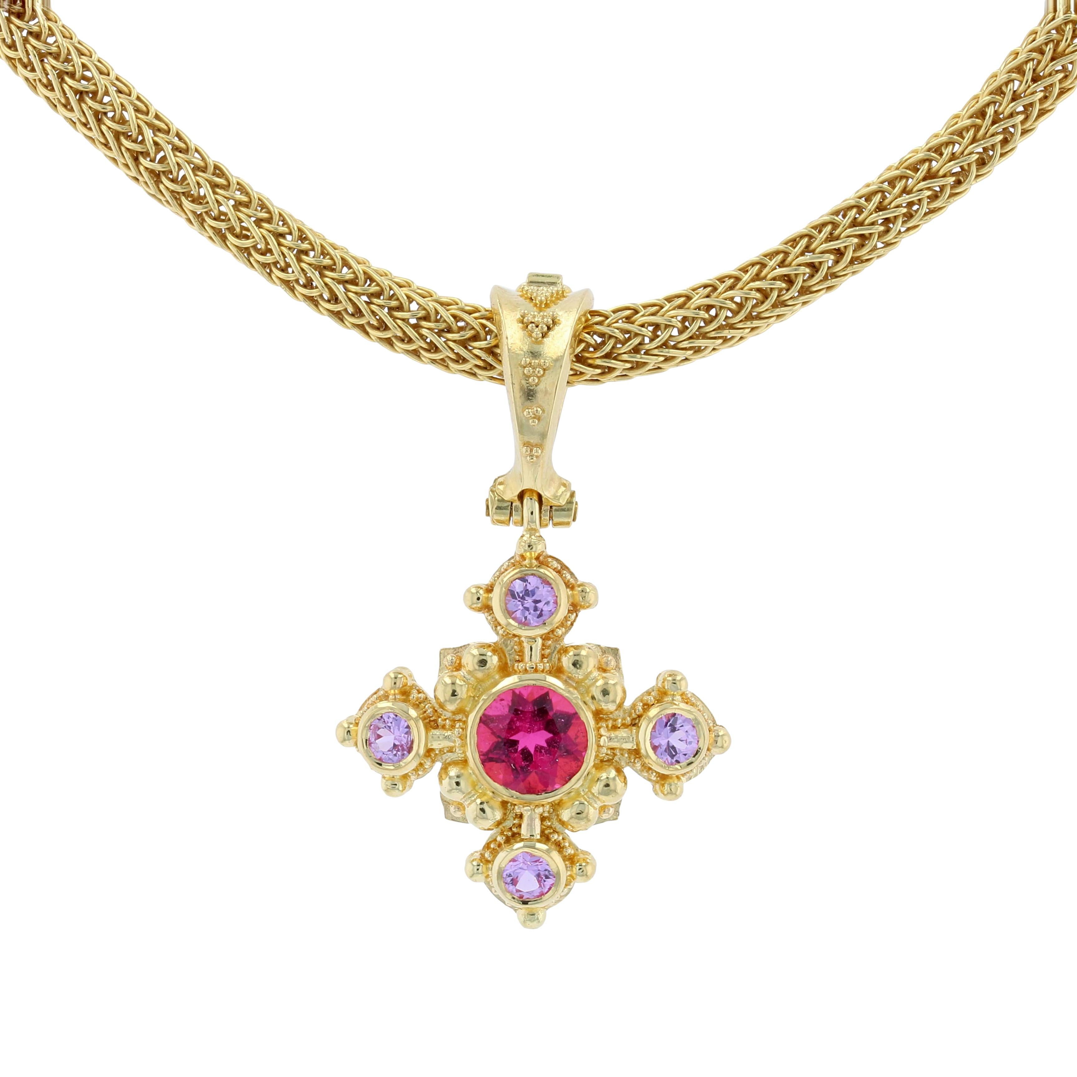 Kent Raible's regal Rubellite Tourmaline Cross Pendant Enhancer with Pink Sapphire accents comes to us from his limited edition 'Studio Collection'.
In keeping with the quote from the curator of the Smithsonian (see below) this iconic jewelry