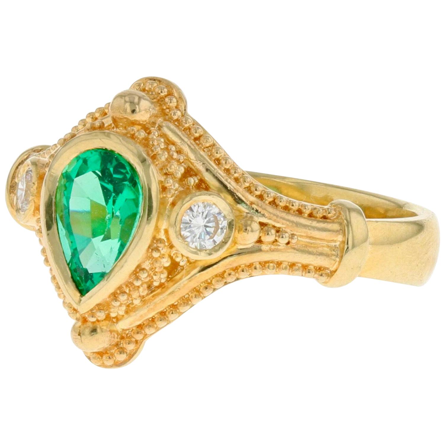Kent Raible 18 Karat Gold Emerald and Diamond Three-Stone Ring with Granulation