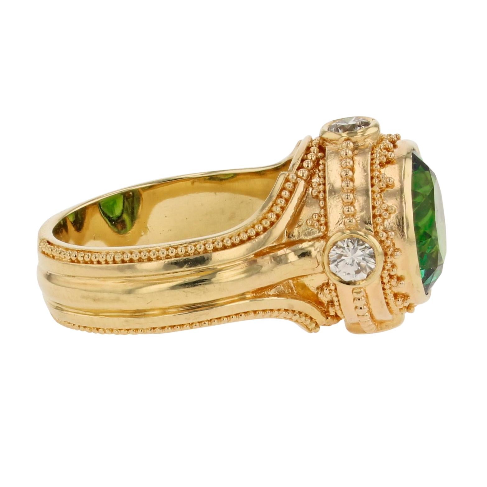 From the Kent Raible limited edition 'Studio Collection', this ring boasts a bold, unique and striking design which showcases the deep rich Green Tourmaline cut specifically for this ring design. Accented with the clean bright sparkle of diamonds,