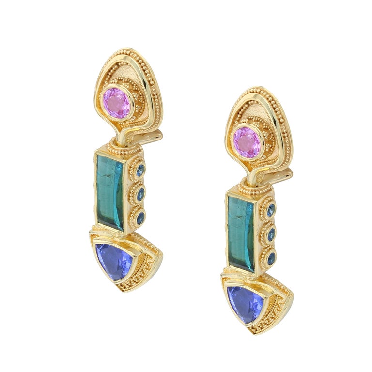 These colorful gold granulated one of a kind earrings come to us from the Kent Raible 'Master Works' collection. They are a dazzling display of brilliant splashes of color and the finest craftsmanship.
Each gemstone represents top quality in its