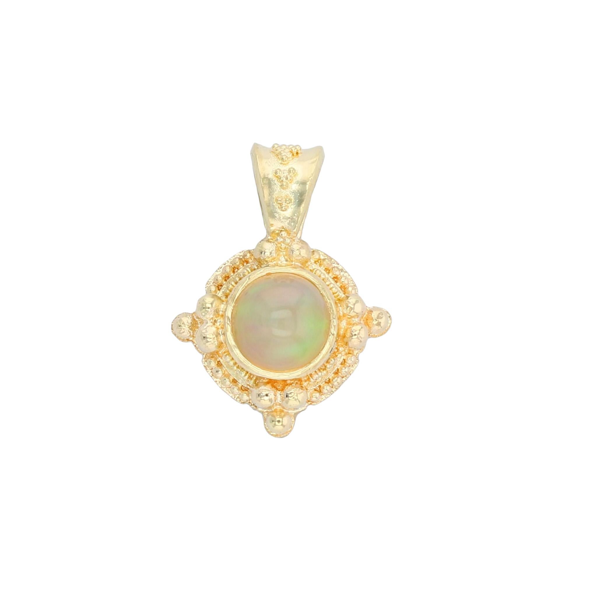 From the Kent Raible limited edition 'Studio Collection' we have his Ethiopian Opal Pendant enhancer.  This pendant, in its classic shape, offers the multi color flashes found only in Opal, all framed in intricate detail and fine granulation in true